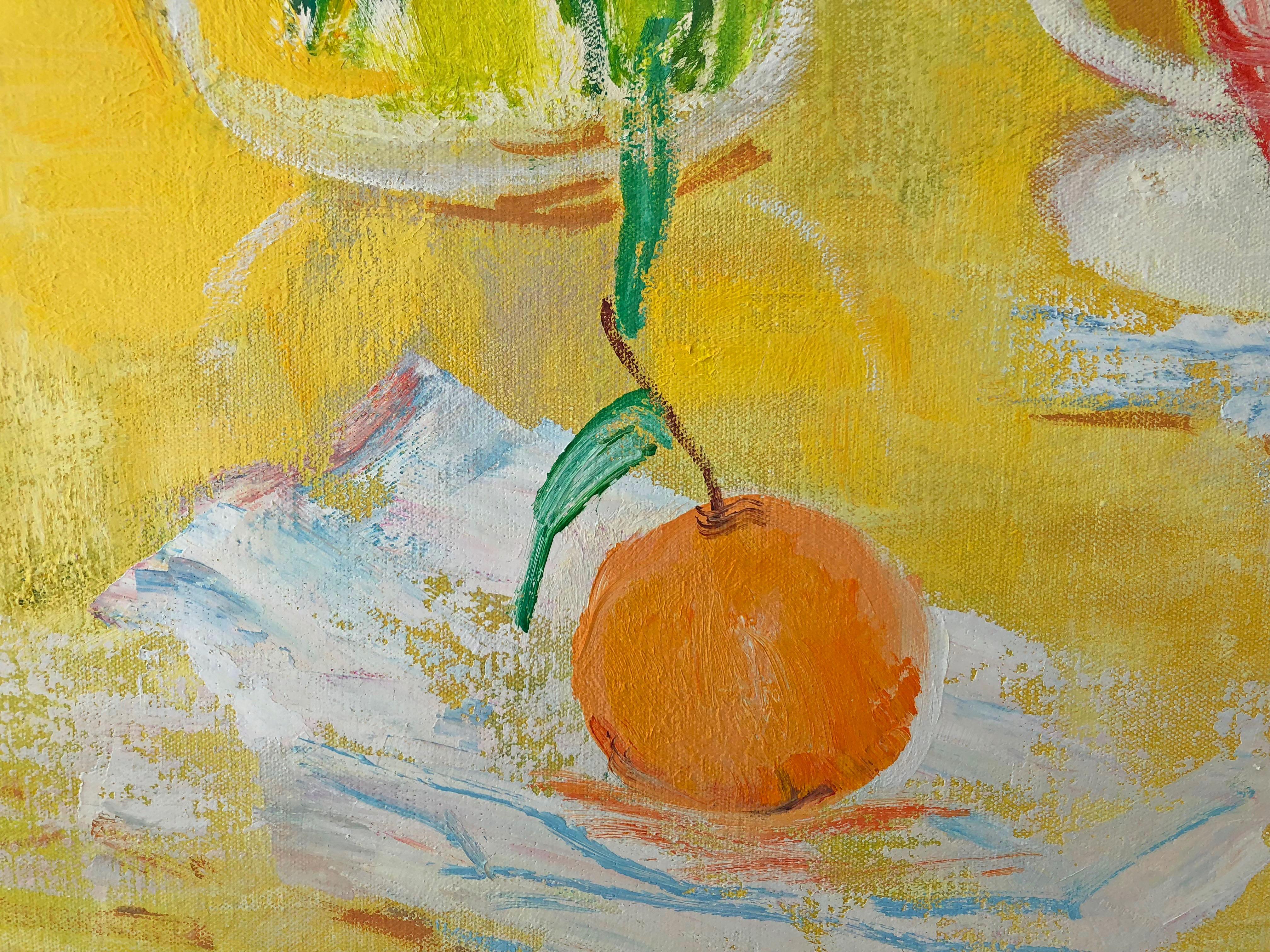 In this landscape oil painting on canvas, a cheerful outdoor scene is set with a still life arrangement of bright pink gladiolus flowers in a clear glass vase beside a smaller orange bouquet atop a lively yellow tablecloth. Painted tea cups and tea