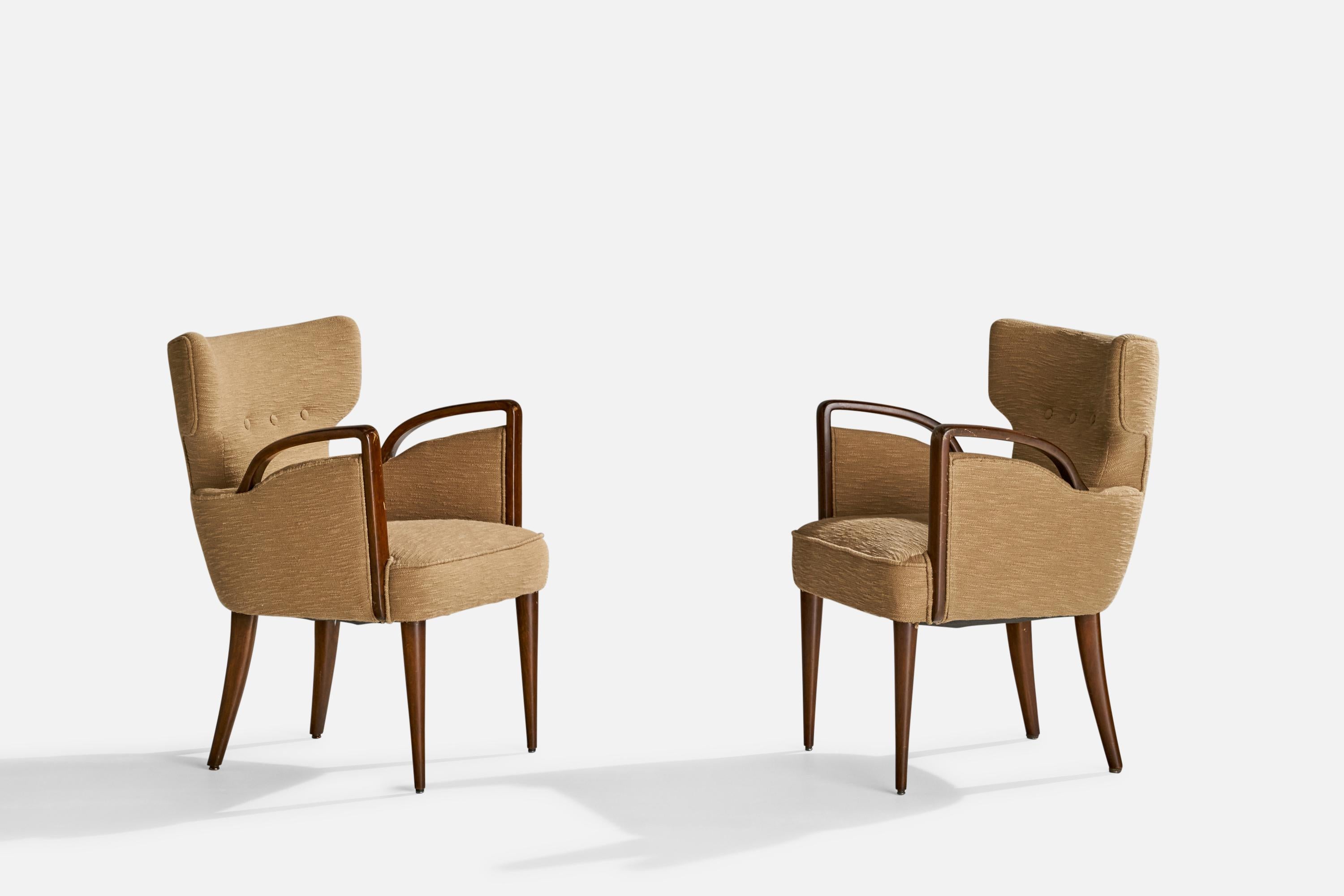 A pair of dark-stained wood and beige fabric armchairs designed by Melchiorre Bega and produced by Figli Di Amadeo Cassina, Italy, c. 1949.

Seat height 17”.
