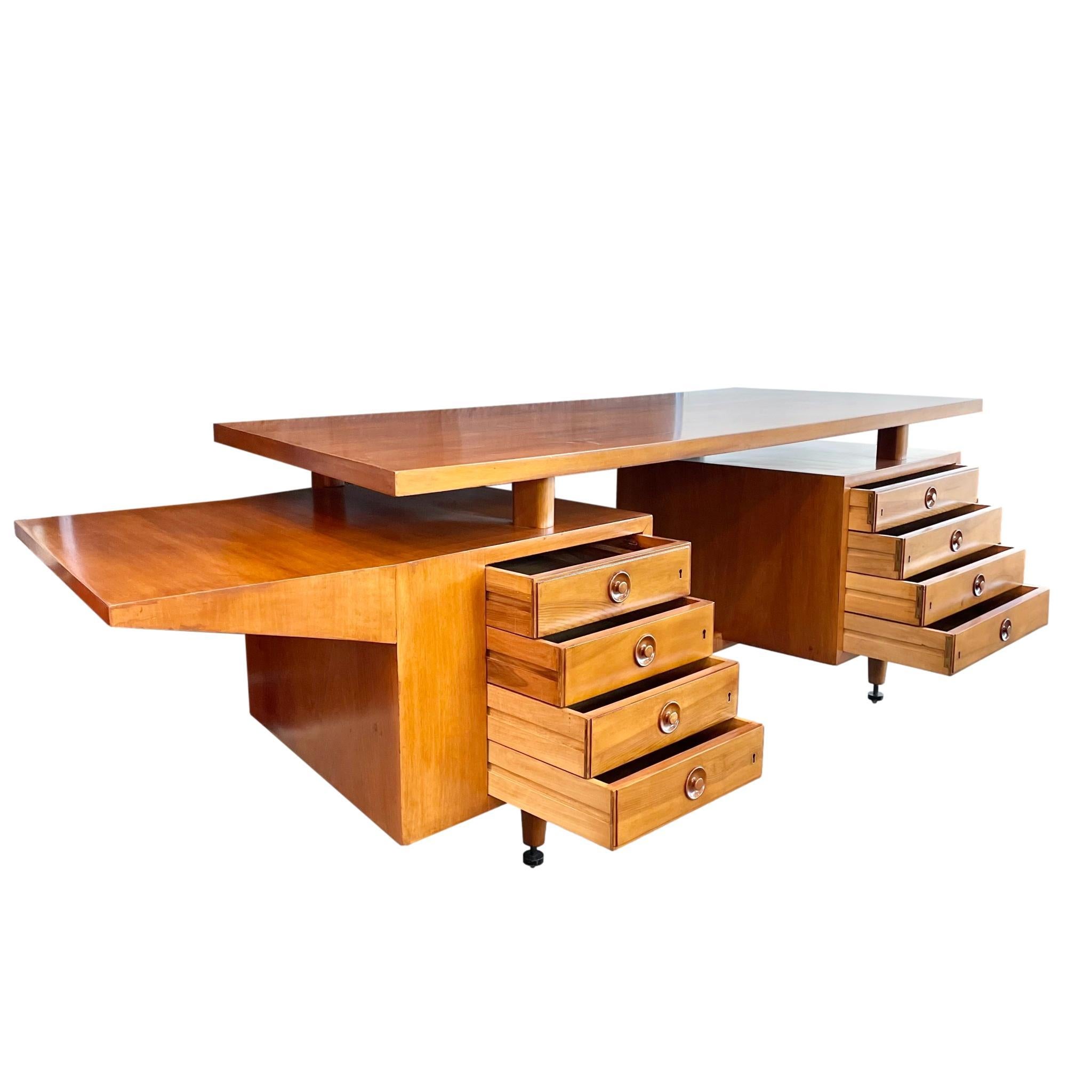 Stunning Italian desk in a beautiful caramel wood. Four pull-out drawers flank each side of the desk. Angular extension on the left side of the desk for extra writing space and fantastic design. Desktop is elevated 3-4 inches above the frame sitting