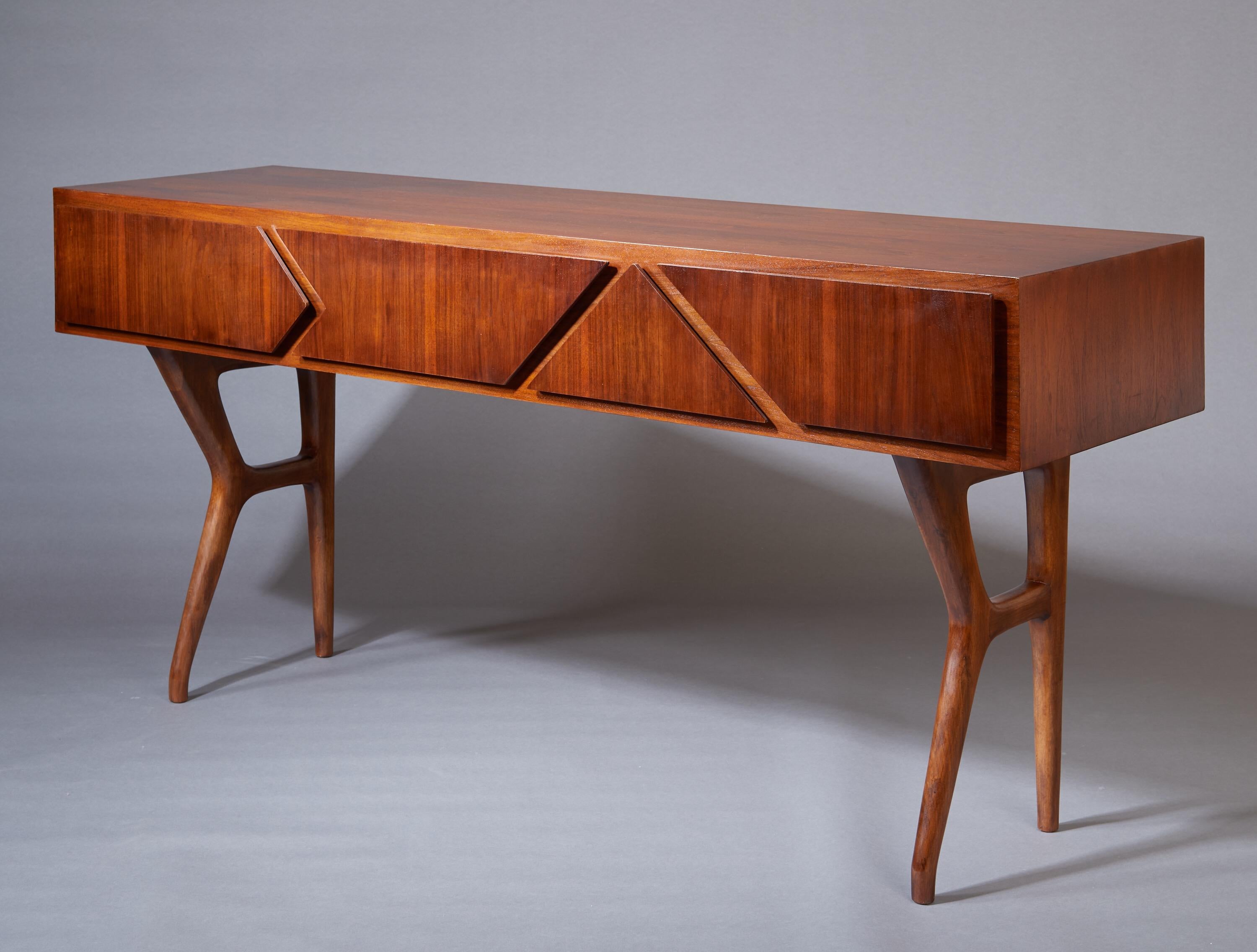 Melchiorre Bega (1898-1976)

A large and important console by Bolognese architect and designer Melchiorre Bega, in polished walnut. The elongated rectangular top, enhanced by a beautiful tactile grain and precise craftsmanship, features four