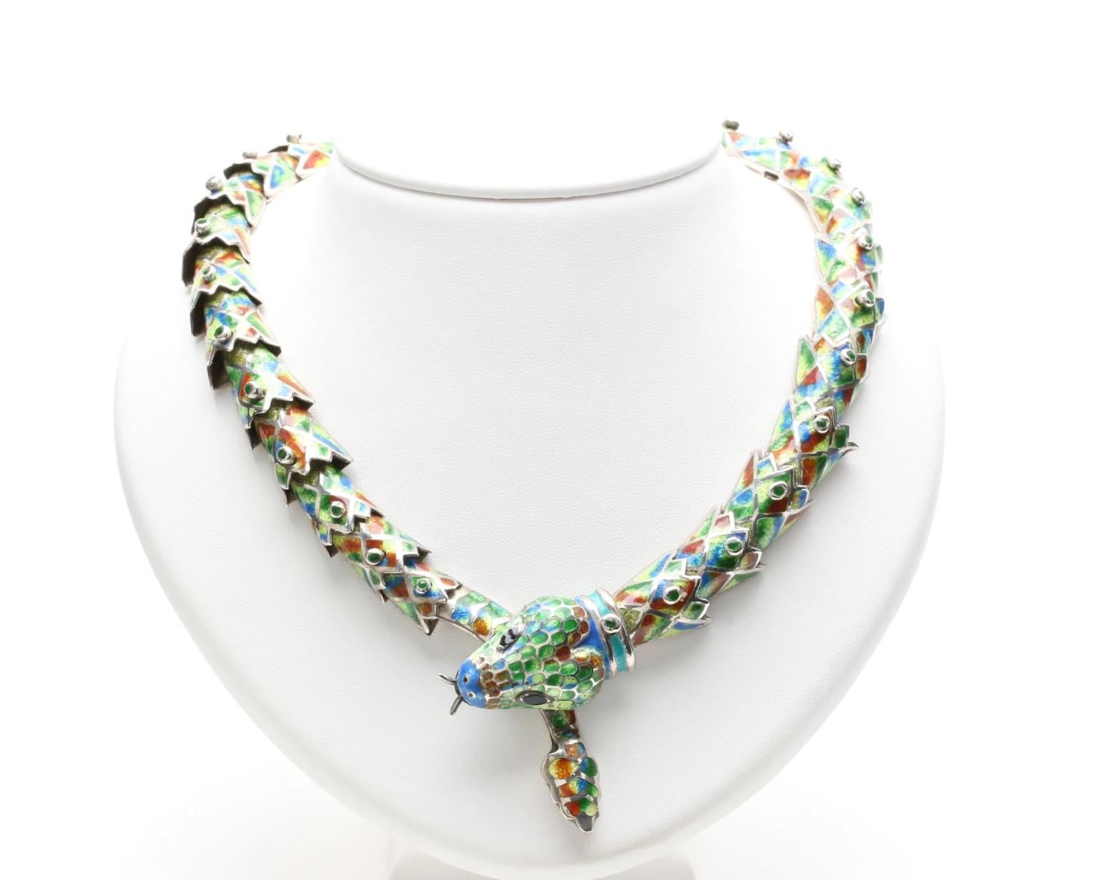 This stunning vintage snake necklace finely crafted by Mexico Maestro Melesio Rodriguez for Margot de Taxco, showcases a 925 silver enhanced with rich enamel inlays. The articulated 32 panel piece boasts a fabulous three dimensional depth with