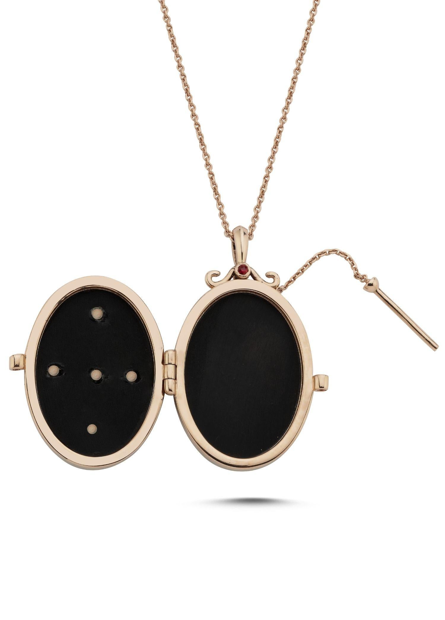 Melie Jewelry Golden Compass Locket Necklace

14K Rose Gold, 0.02 ct White Diamond/ G-VS, 0.09 ct Blue Sapphire, 0.16 ct Ruby, 0.07 ct Emerald, Onyx.
Locket Necklace comes with a gold 46 cm chain.

The Story Behind
The Golden Compass Locket is