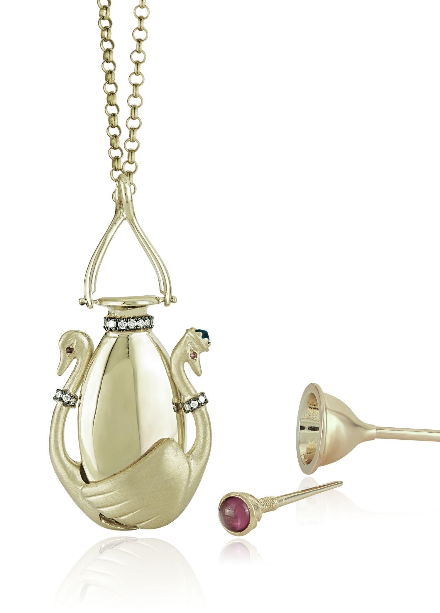 Swans in Love Perfume Bottle Necklace

18K Yellow Gold, 0.14 ct White Diamond, 0.07 ct Blue Sapphire, 0.03 ct Ruby, 0,65 ct Rhodolite
Perfume Necklace comes with a gold 70cm chain & silver funnel.

The Story Behind
The male and female swans are