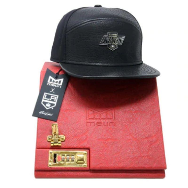 Melin Black Limited Edition 50 Years L.A Kings Napa Leather 8PT Diamond Karat

Gear up with this L.A. Kings 50th Anniversary Limited Edition Wool Napa Leather Cap. Featuring a genuine 8 point VS diamond set into a custom hand finished chevron logo