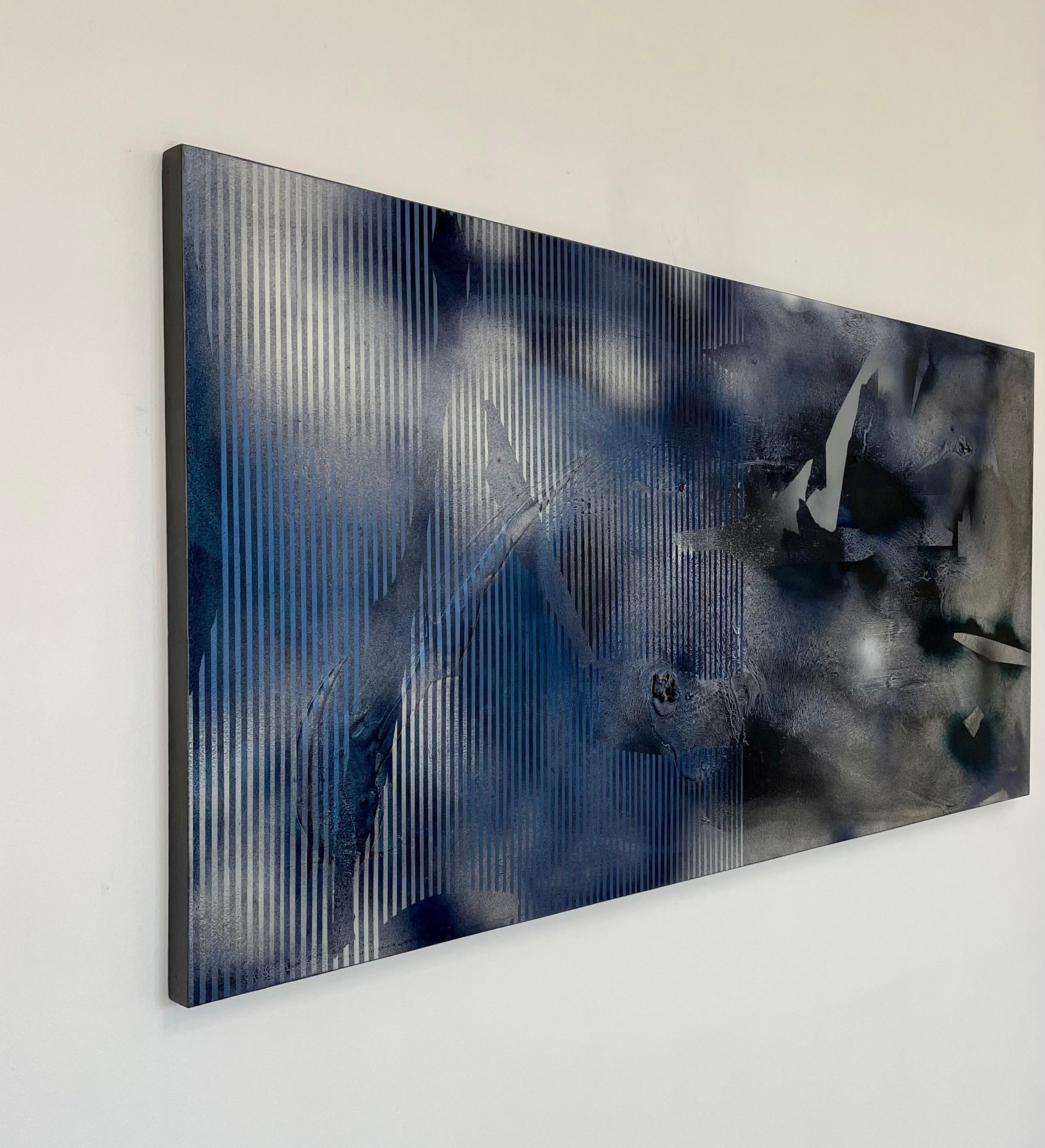 Melisa Taylor Metzger’s Sateen X2 extends her exploration of surface and gesture with a composition that feels simultaneously luminous and turbulent. Broad washes of deep cobalt and graphite unfold across the canvas, interrupted by sharp geometric
