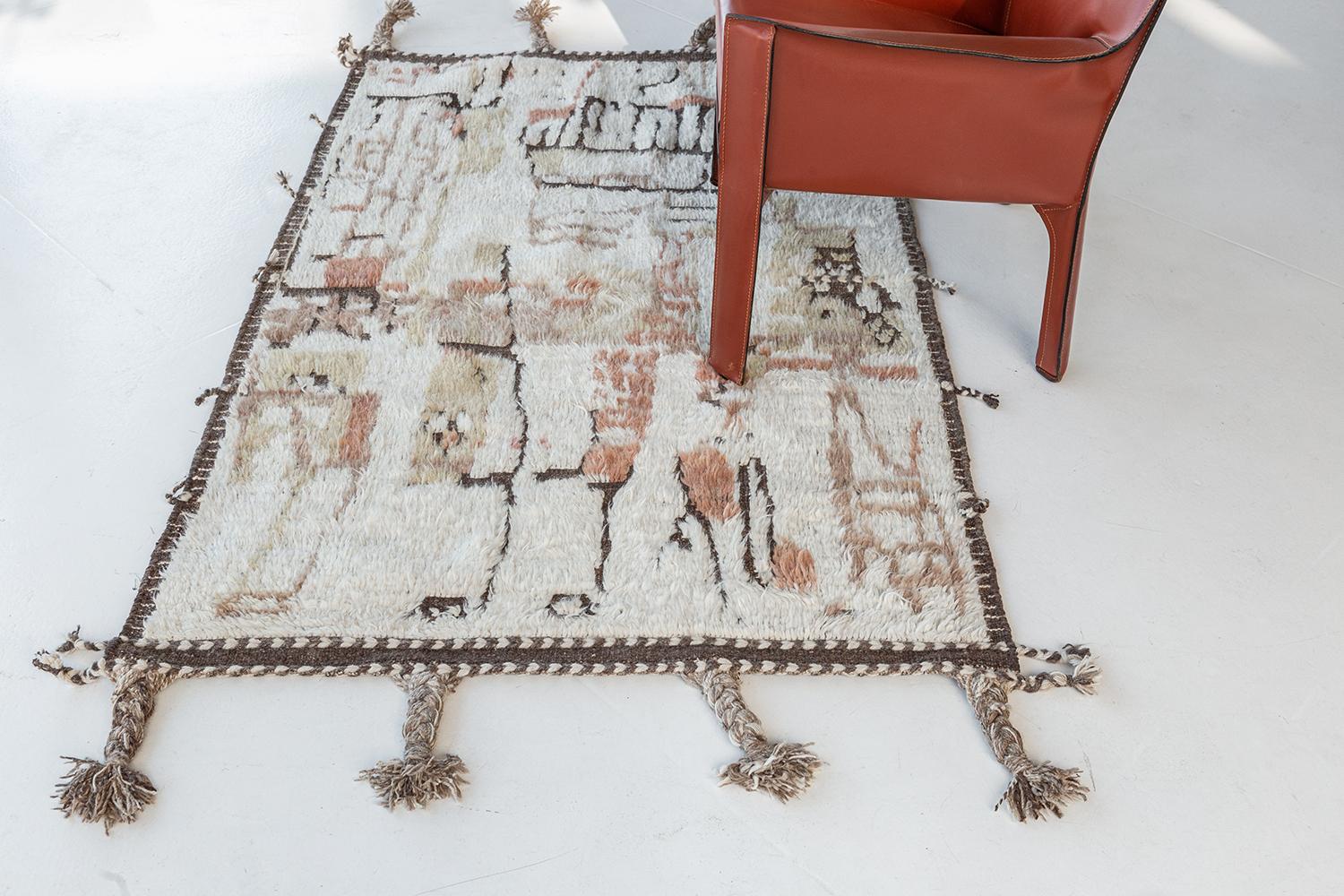 Meliska is a captivating textured rug with irregular motifs inspired by the Atlas Mountains of Morocco. Earthy tones of ivory, cream, and chocolate brown surrounded by umber brown shag work cohesively to make for a great contemporary interpretation