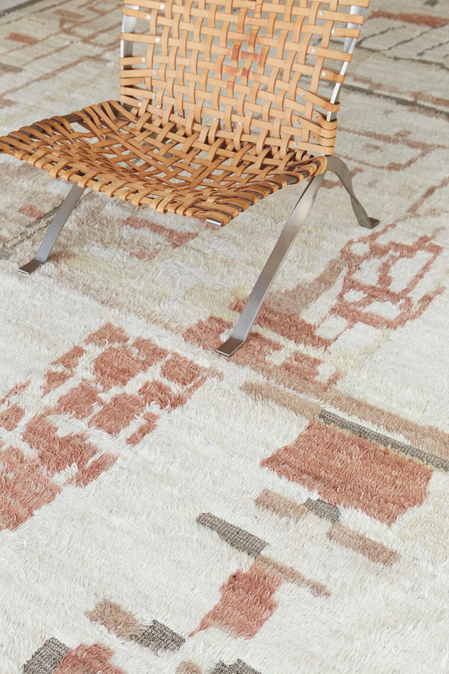 Meliska' is a beautifully textured rug with irregular motifs inspired by the Atlas Mountains of Morocco. Natural blush, cedar, and ginger surrounded by ivory shag work cohesively to make for a great contemporary interpretation for the modern design