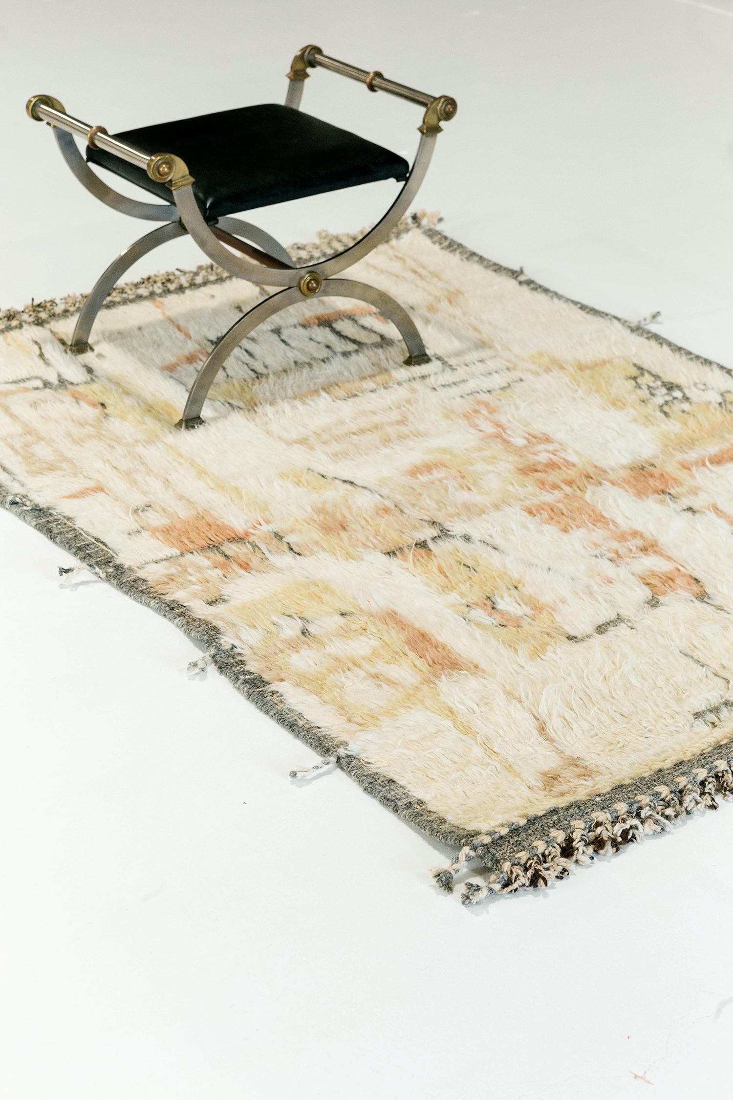 Meliska' is a beautifully textured rug with irregular motifs inspired from the Atlas Mountains of Morocco. Natural blush, golden yellow, and Sedona red surrounded by ivory shag work cohesively to make for a great contemporary interpretation for the