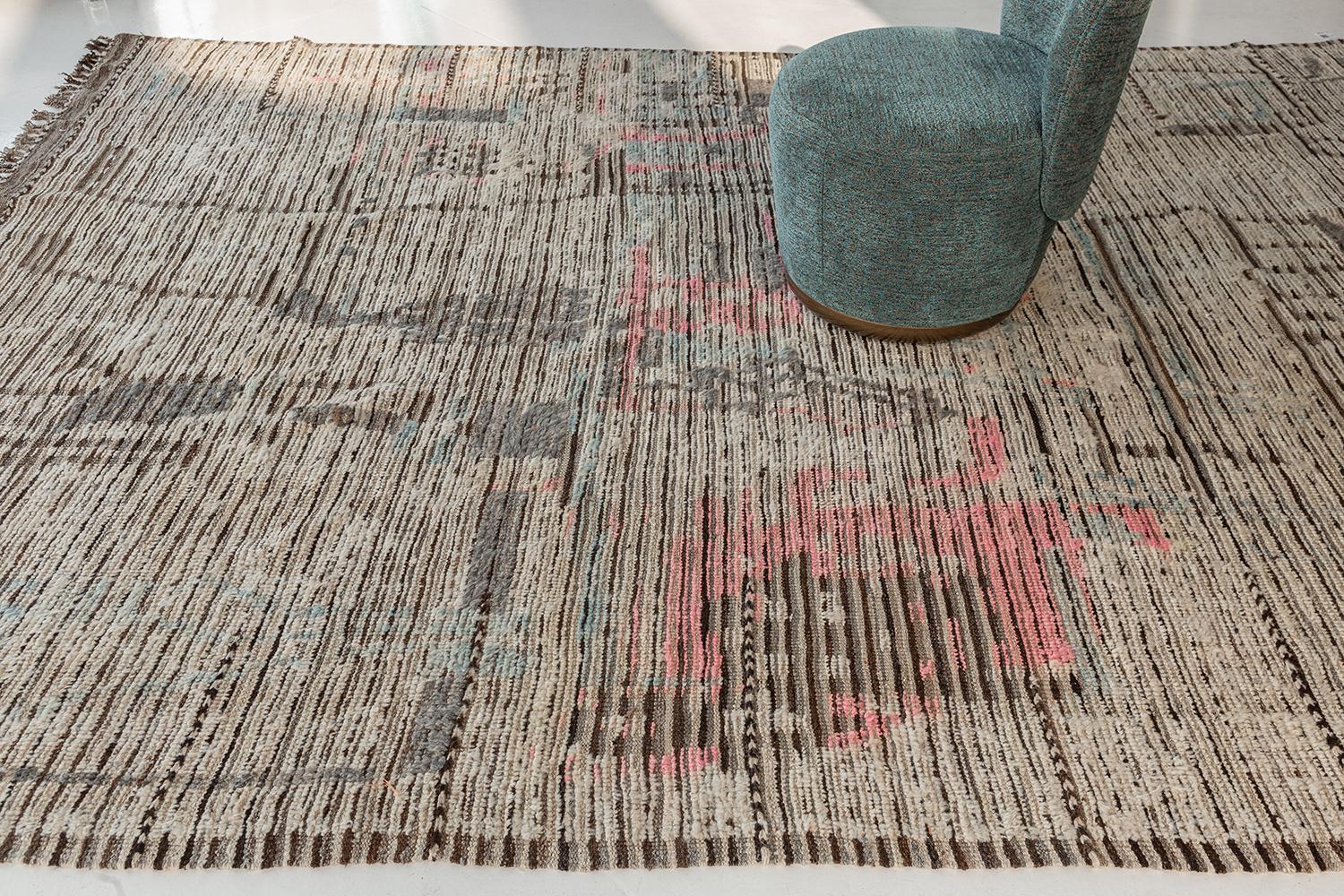 Meliska is a captivating textured rug with irregular motifs inspired by the Atlas Mountains of Morocco. Earthy tones of ivory, rose, and chocolate brown surrounded by umber brown shag work cohesively to make for a great contemporary interpretation