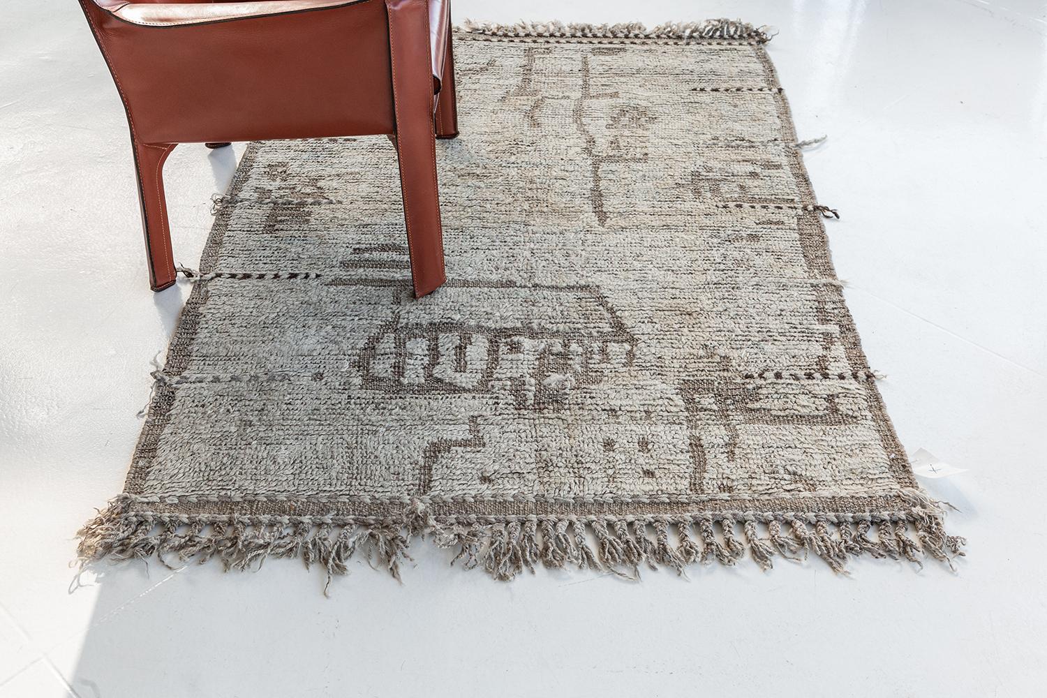 Meliska is a captivating textured rug with irregular motifs inspired by the Atlas Mountains of Morocco. Earthy tones of ivory, and chocolate brown surrounded by umber brown shag work cohesively to make for a great contemporary interpretation for the