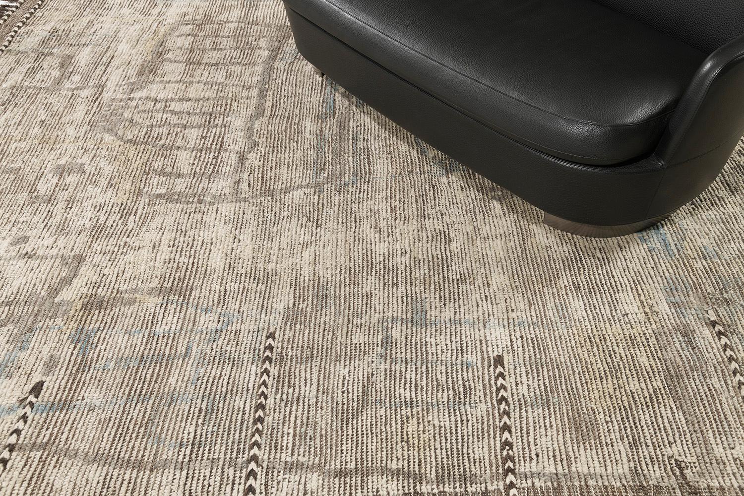 Meliska is a captivating textured rug with irregular motifs inspired by the Atlas Mountains of Morocco. Earthy tones of gold, blue, and surrounded by natural brown work cohesively to make for a great contemporary interpretation for the modern design