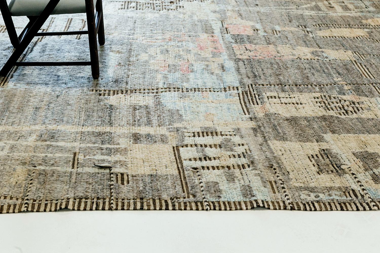 Meliska' is a beautifully textured rug with irregular motifs and stripped patterning inspired from the Atlas Mountains of Morocco. Taupe, light yellow and sky blue colors work cohesively to make for a great contemporary interpretation for the modern
