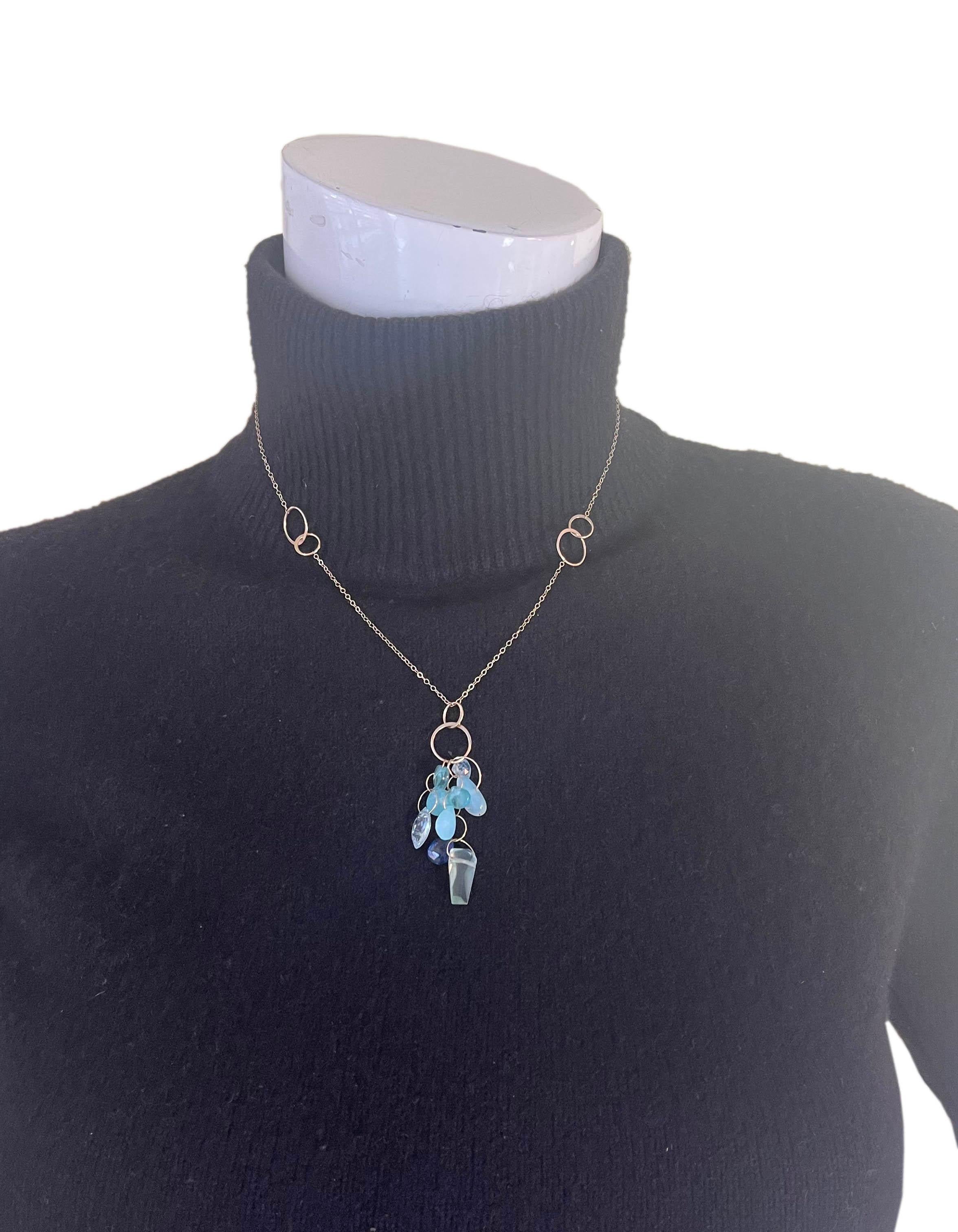 Melissa Joy Manning 14K Yellow Gold Chainlink Lariat w/Blue Topaz, Aquamarine, Lolite & Chalcedony Cluster Pendant
Made In: USA
Materials: 14K yellow gold, topaz, aquamarine, lolite, chalcedony
Closure/Opening: Hook
Overall Condition: