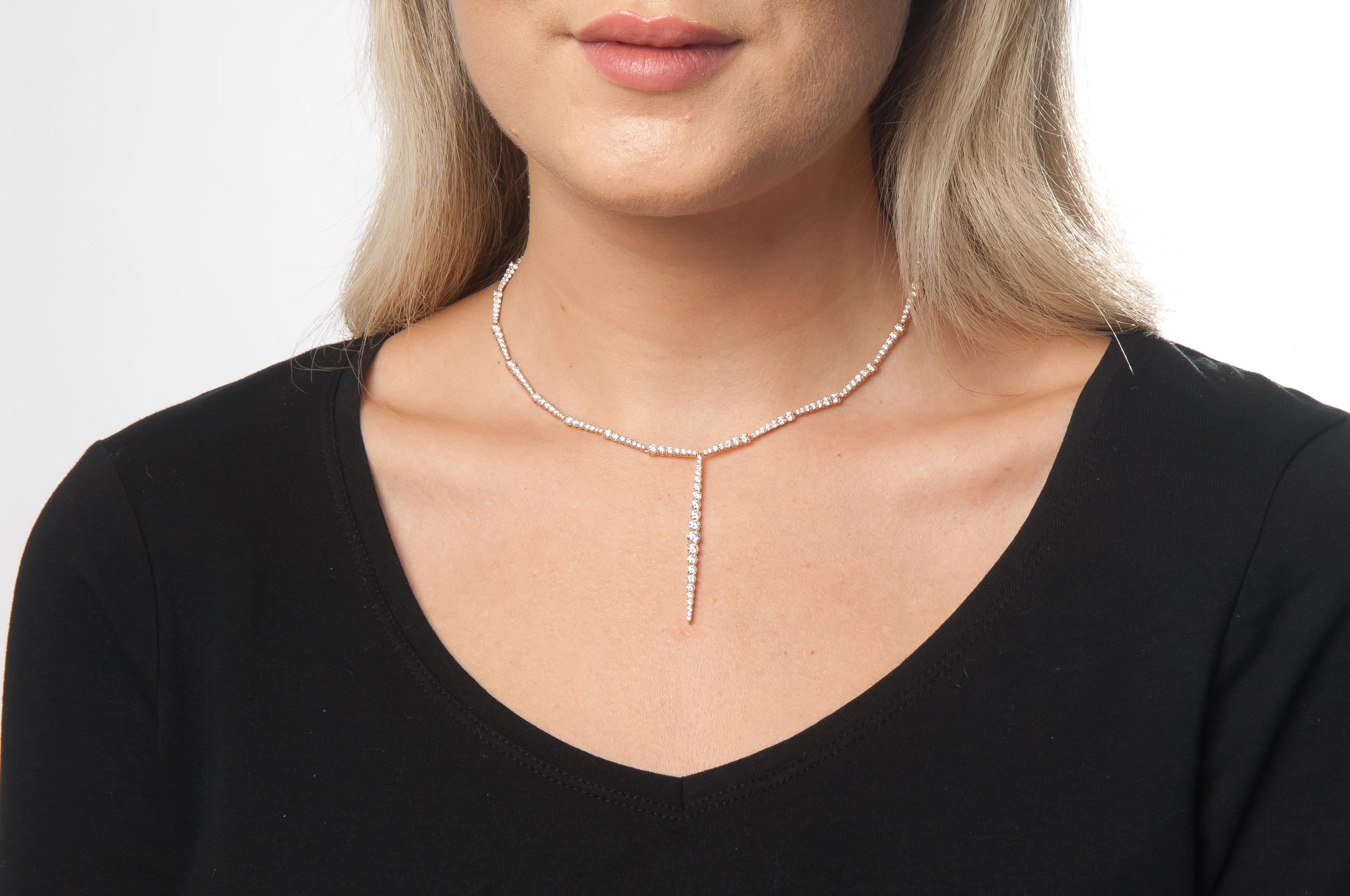 The Stiletto necklace is simple in design, but rich in detail. A modified lariat form with diamonds of graduating then tapering sizes that add dimension.

7.97 Total Carat Weight
18K Rose Gold with Diamonds
The necklace is 15.5 inches long
Drop is 2