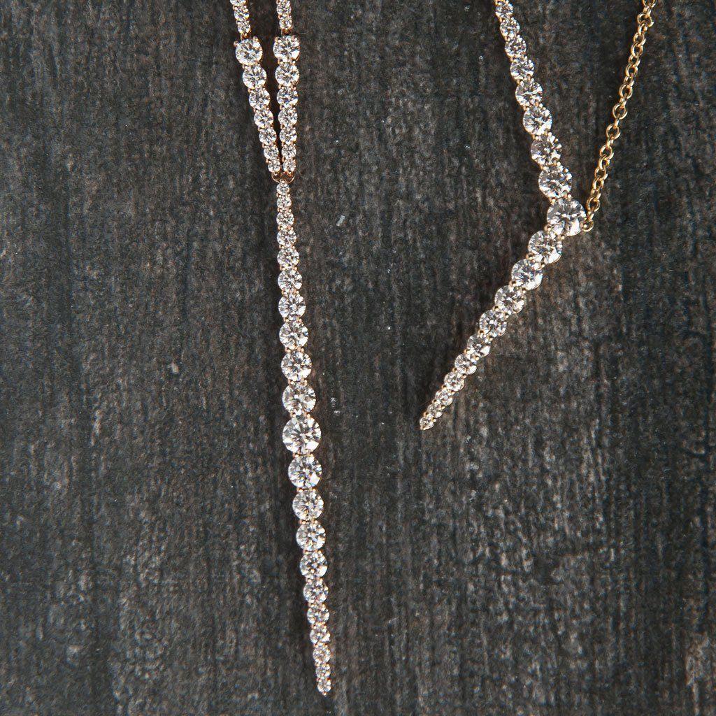 Seamlessly blending feminine lines and geometric shapes, this necklace is set with glistening diamonds that beautifully highlight the unique integrated “Y” pendant.

18K yellow gold chain with white diamond pendant (1.61 tcw)
14 – 15” adjustable