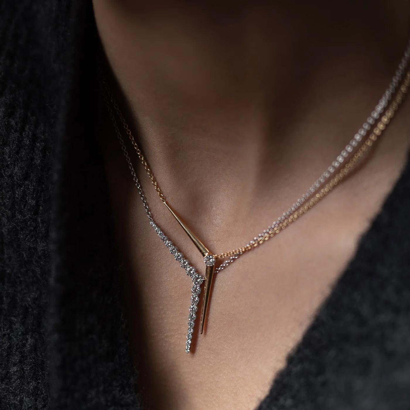Seamlessly blending feminine lines and geometric shapes, this necklace is set with glistening diamonds that beautifully highlight the unique integrated “Y” pendant.

18K White Gold
Approx. 1.61cts diamonds
49mm pendant length with 30mm pendant