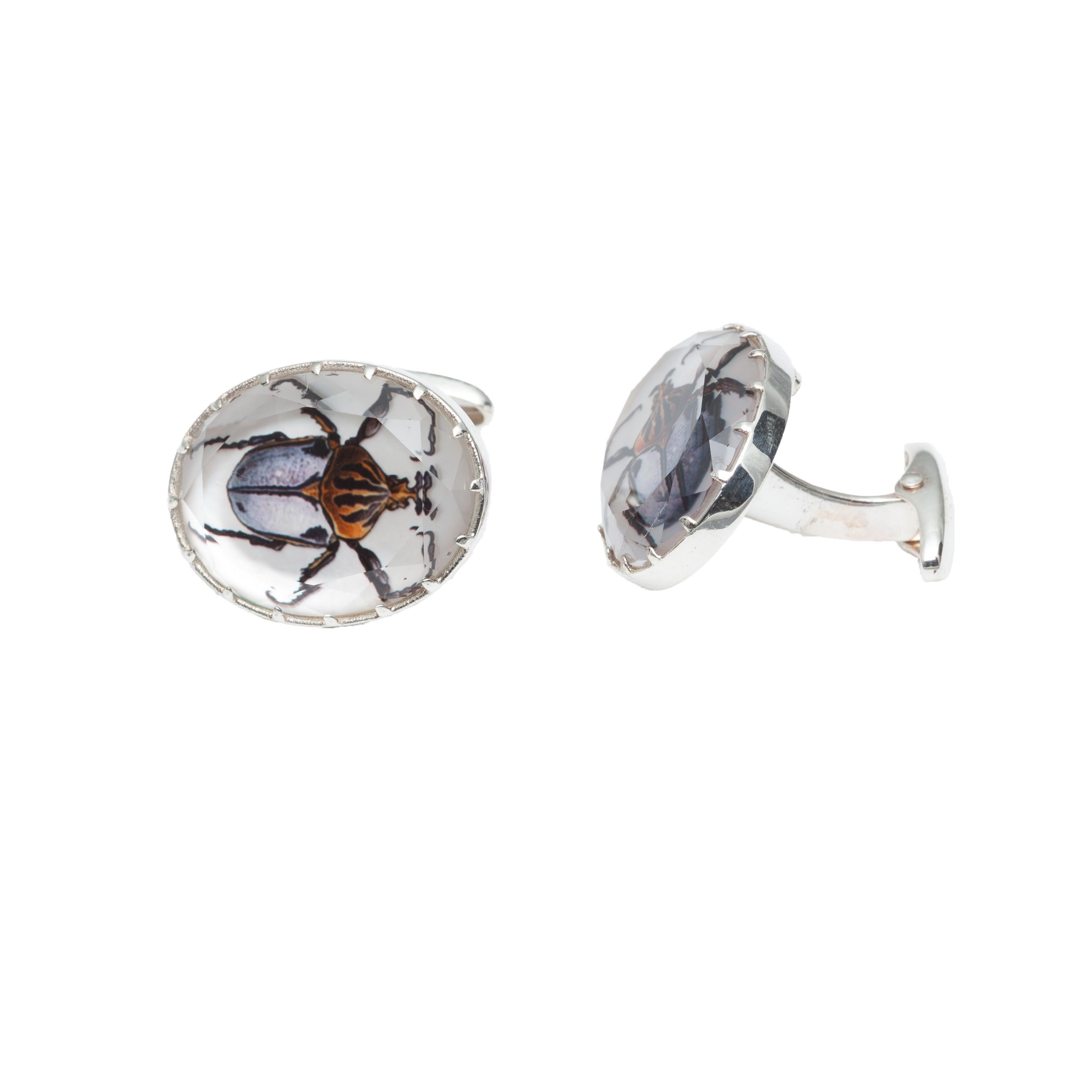 Oval Shaped Spencer Portrait Beetles in Rock Crystal Quartz and Mother of Pearl cufflinks.  Set in sterling silver (31.65CTW).  Frames Measure .875x75 inches.  
