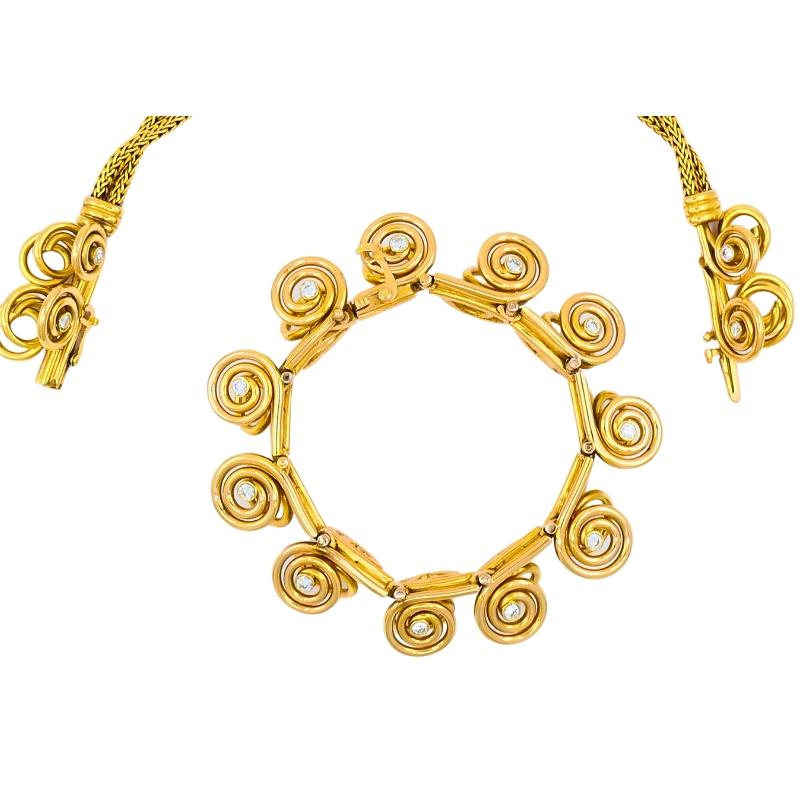 A spectacular Mellerio dits Meller 18k gold diamond necklace, featuring a detachable diamond bracelet.
The necklace’s design includes a series of coiled spirals, each nesting a diamond at the center. A braided gold chain, that is seamlessly attached