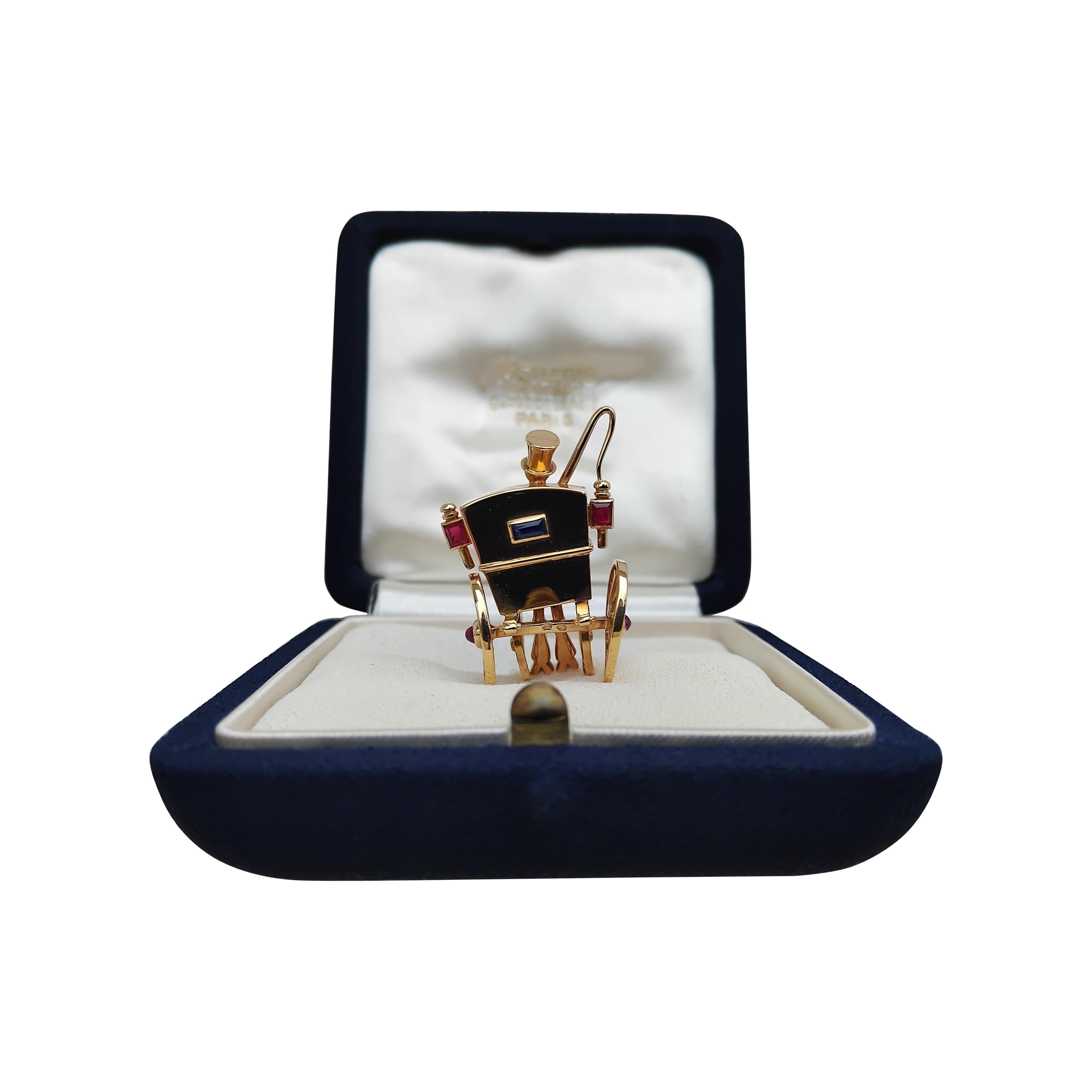 Taille baguette Mellerio Dits Meller Broche de revers en or jaune, rubis et saphirs en vente