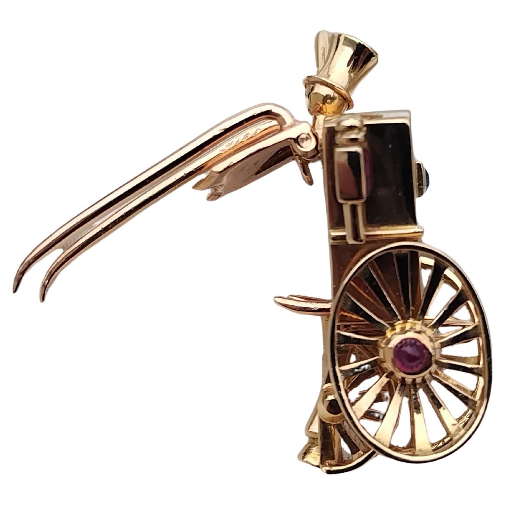 Mellerio Dits Meller Broche de revers en or jaune, rubis et saphirs Pour femmes en vente