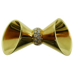 Mellerio Paris 18 Karat Yellow Gold and Diamond Bow Pendant Charm, circa 1980s