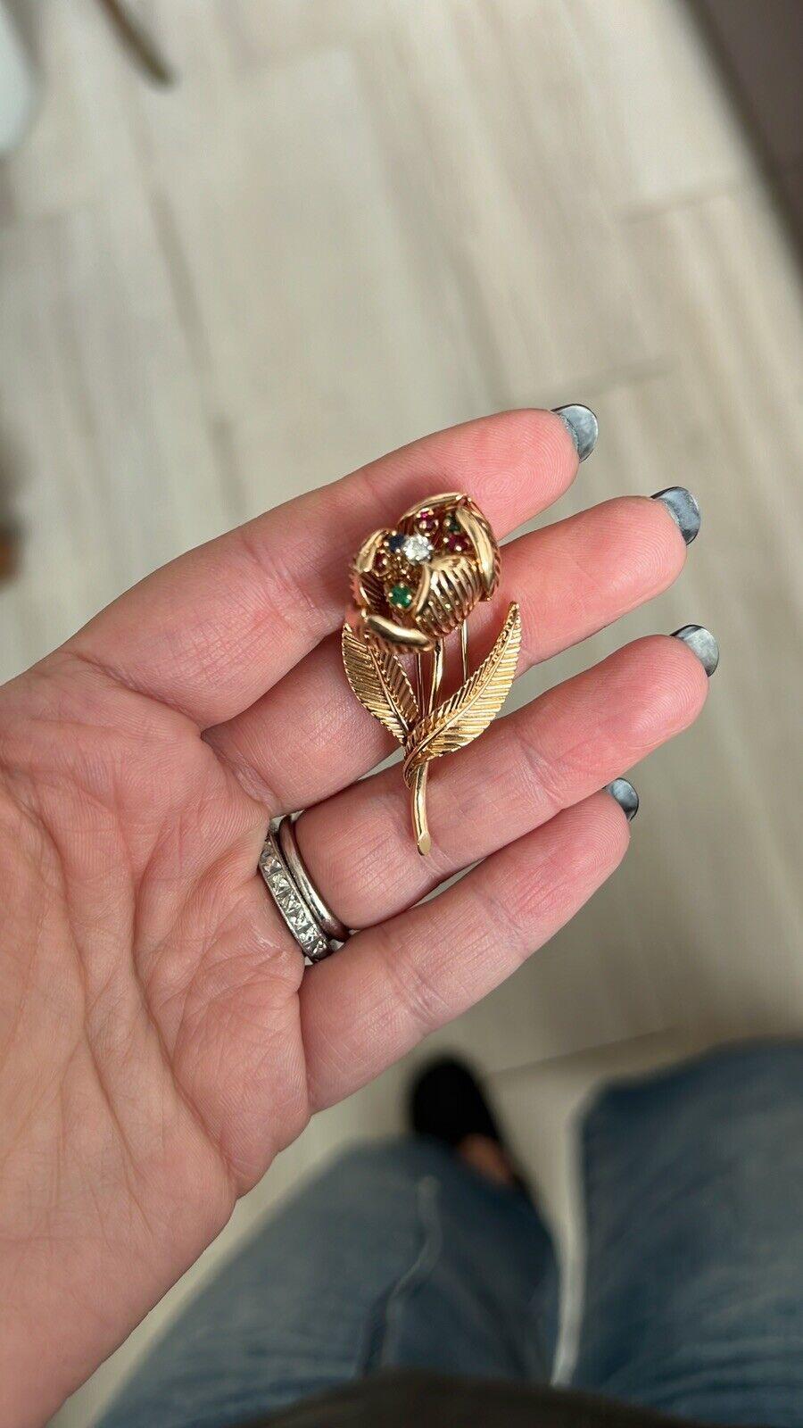 Mellerio Paris 18k Yellow Gold, Diamond & Multi Gemstone Tremblant Flower Clip Brooch Vintage

Here is your chance to purchase a beautiful and highly collectible designer clip brooch.  

The brooch is made in France by Mellerio, and is circa 1950s. 