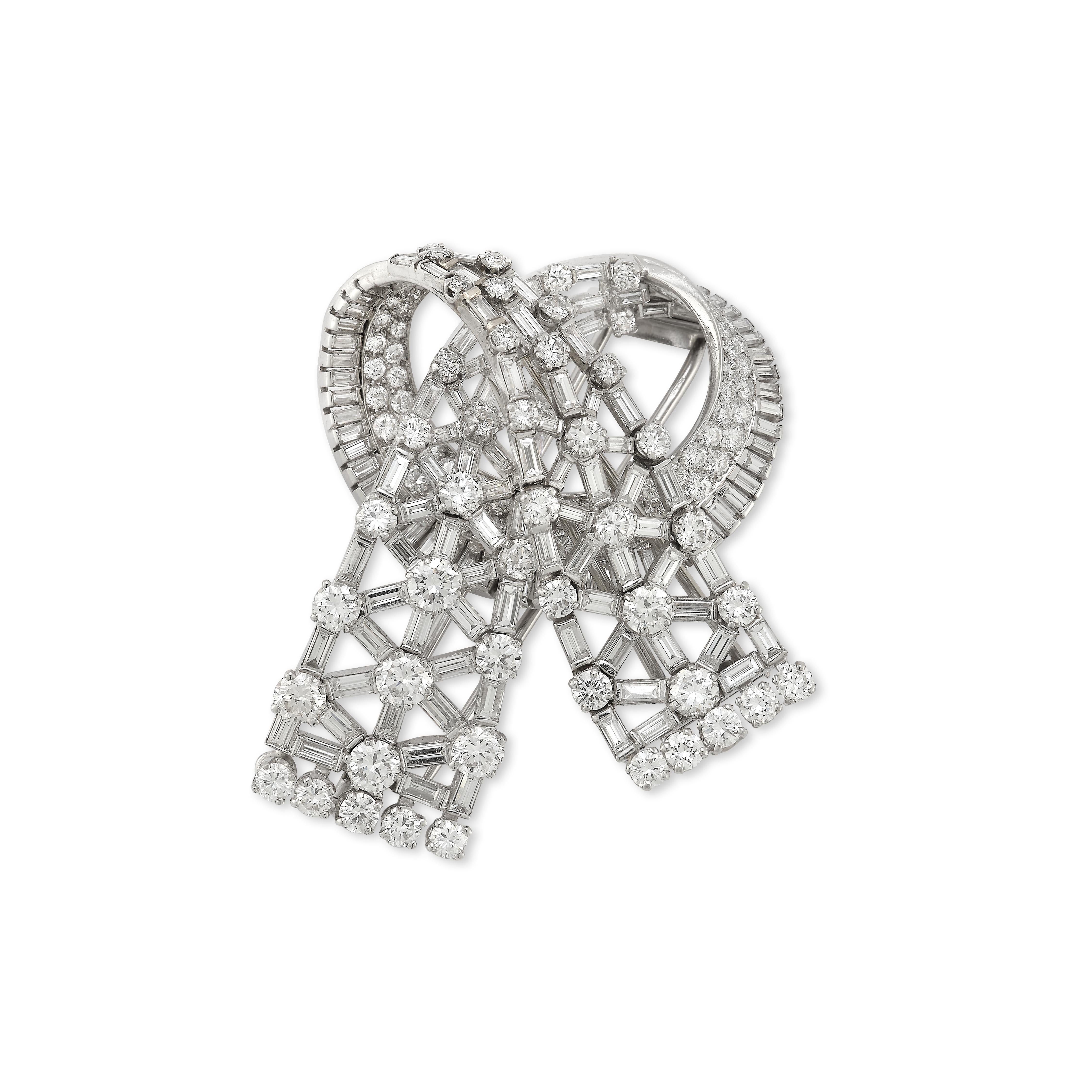 Mellerio Paris Double Clip Bow Brooch

A platinum brooch set with 103 brilliant cut diamonds and 131 baguette cut diamonds weighing approximately 28.08 carats total

Converts into two brooches

Signed Mellerio Paris & numbered

Metal Type: