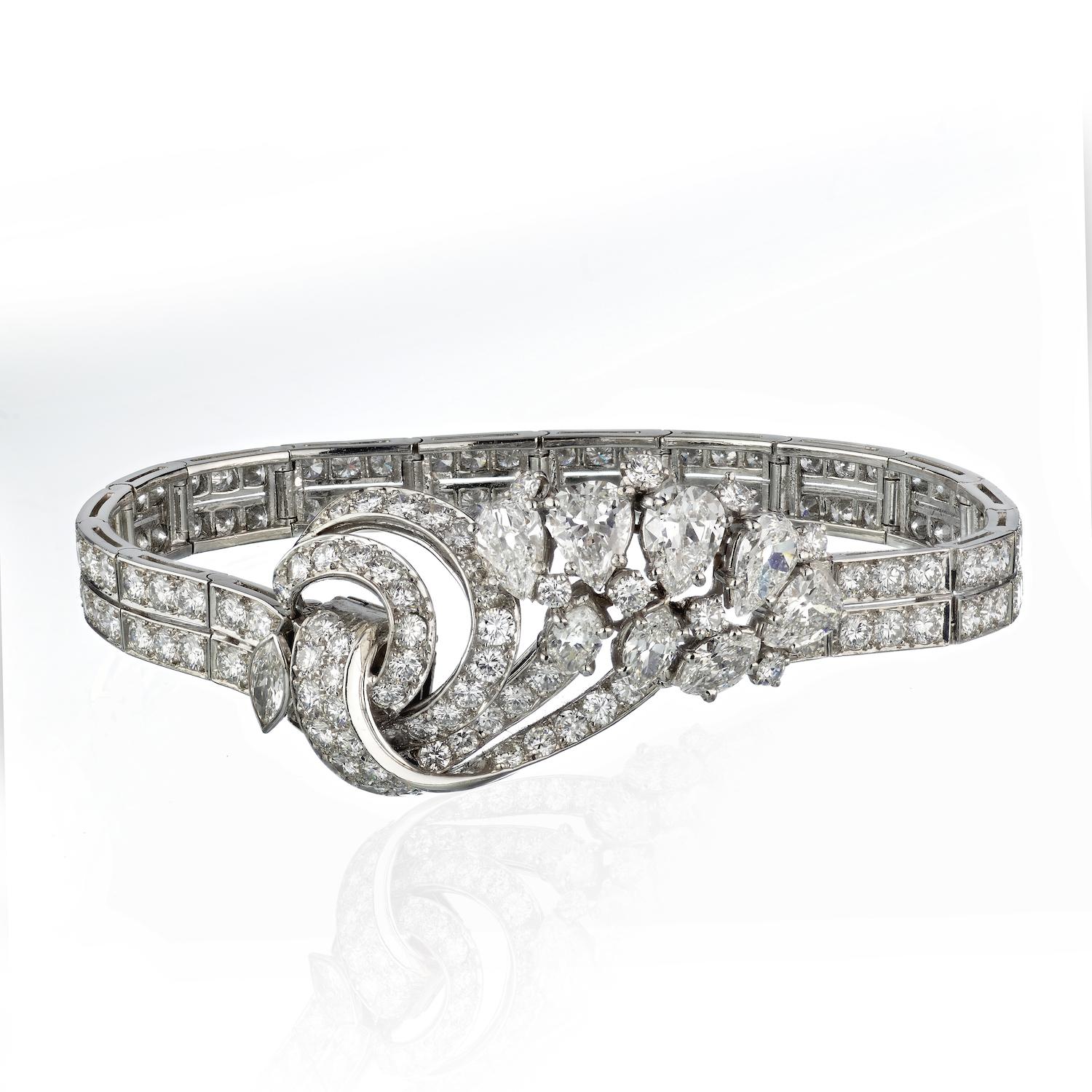 Indulge in the luxury of a bygone era with this exquisite Platinum Diamond Bracelet, adorned with a mesmerizing array of 156 diamonds totaling 13.25 carats. 

The vintage cut round, old cut marquise, and old cut pear diamonds, with their G-H color