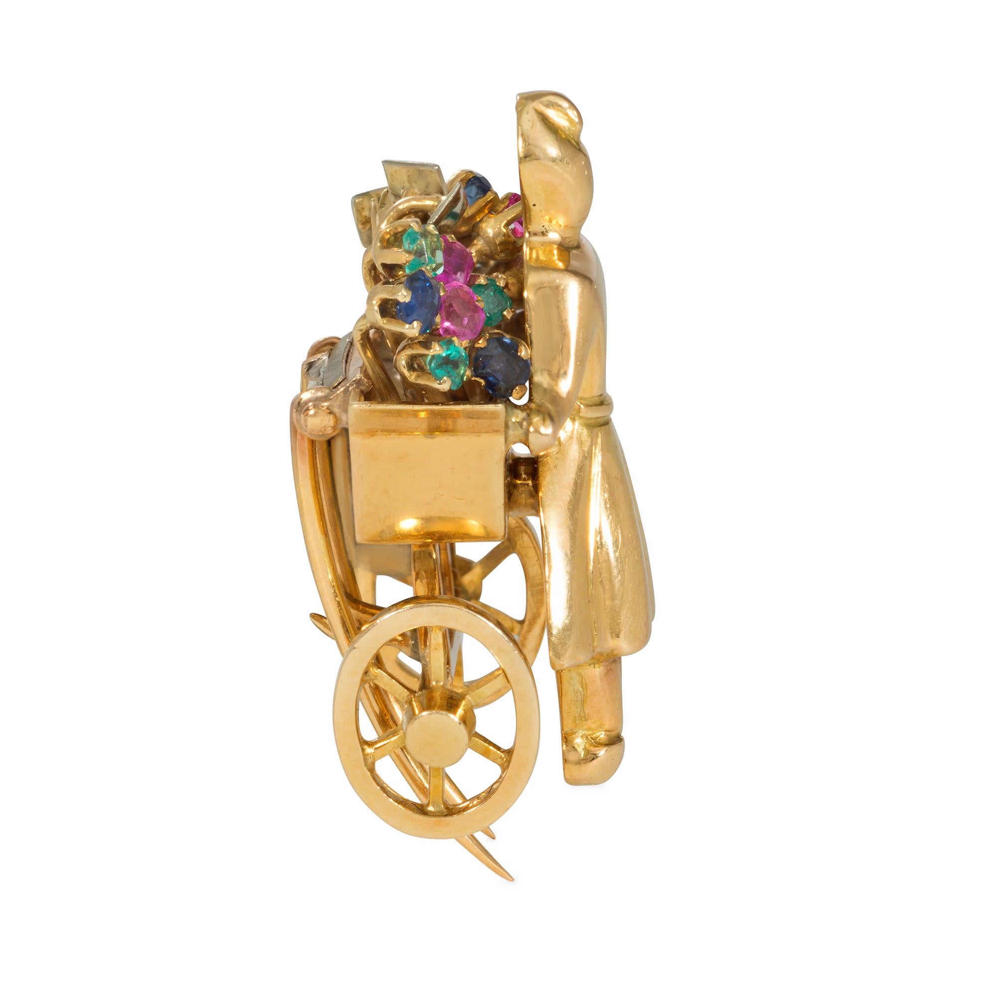 Broche clip fantaisiste en or rétro et pierres précieuses multiples, en forme de personnage poussant un chariot de fleurs, sertie de saphirs, d'émeraudes et de rubis, en 18k avec double tige de fixation.  Mellerio Dits Meller. #49630.