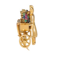 Mellerio Retro Gold and Multi-Gemstone Brooch of Figure with Flower Cart