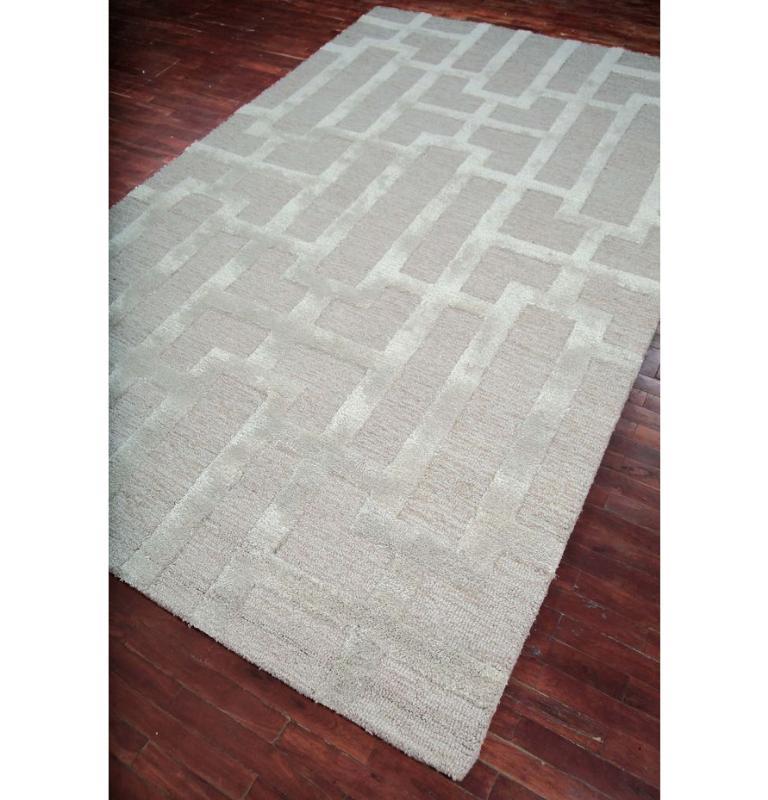 This exquisite handwoven rug from our Contour collection, boasting a palette of Beige and Antique White, showcases an intricate pattern that effortlessly captures the essence of traditional craftsmanship. One can find this beauty in various standard