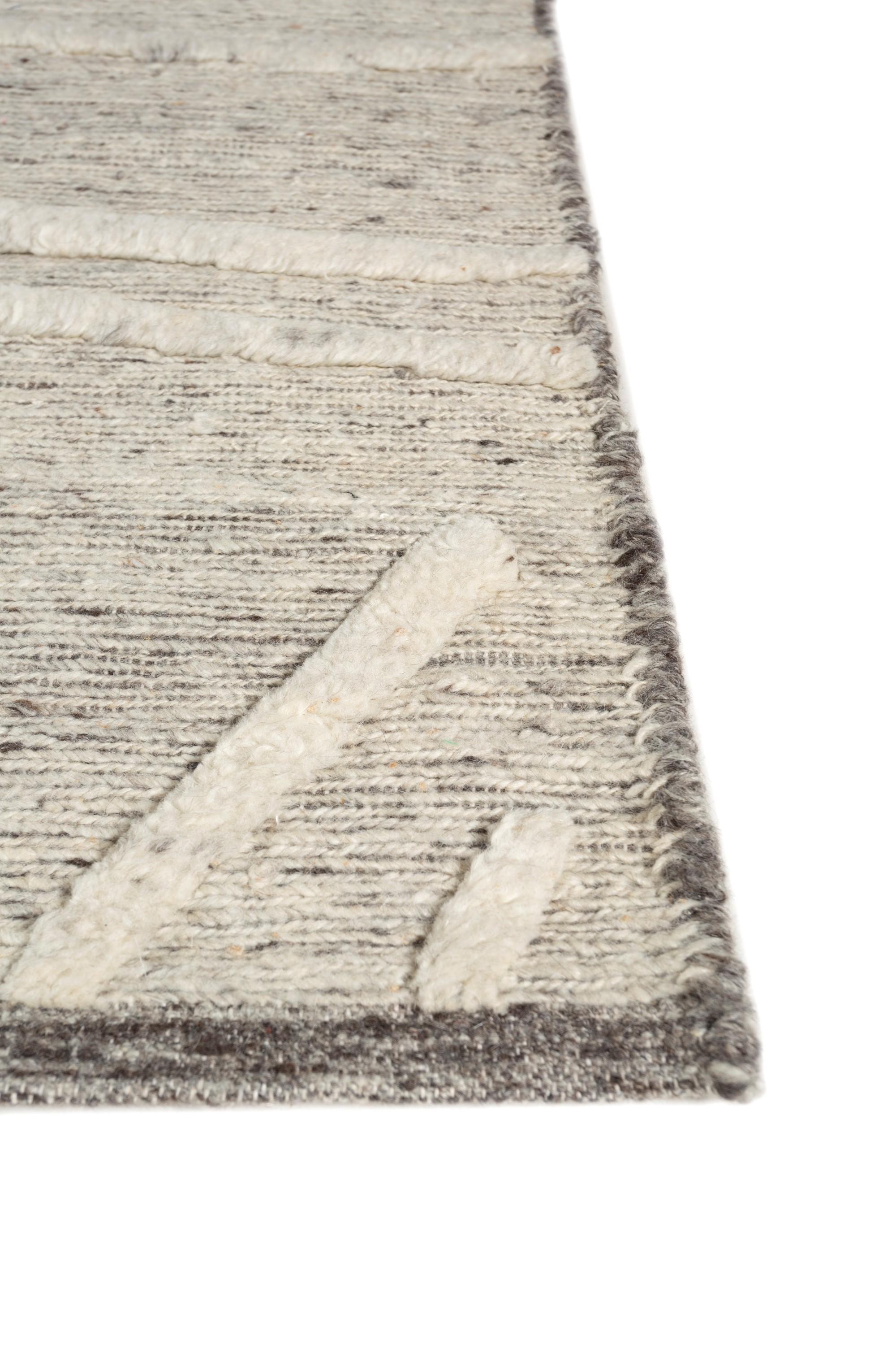 Indulge in the serene allure of this rug from our Manifest collection, a true masterpiece that beckons you to step into a world of tranquility and grace. The pattern of this rug is like a lyrical dance, where gentle waves of light blue and peach