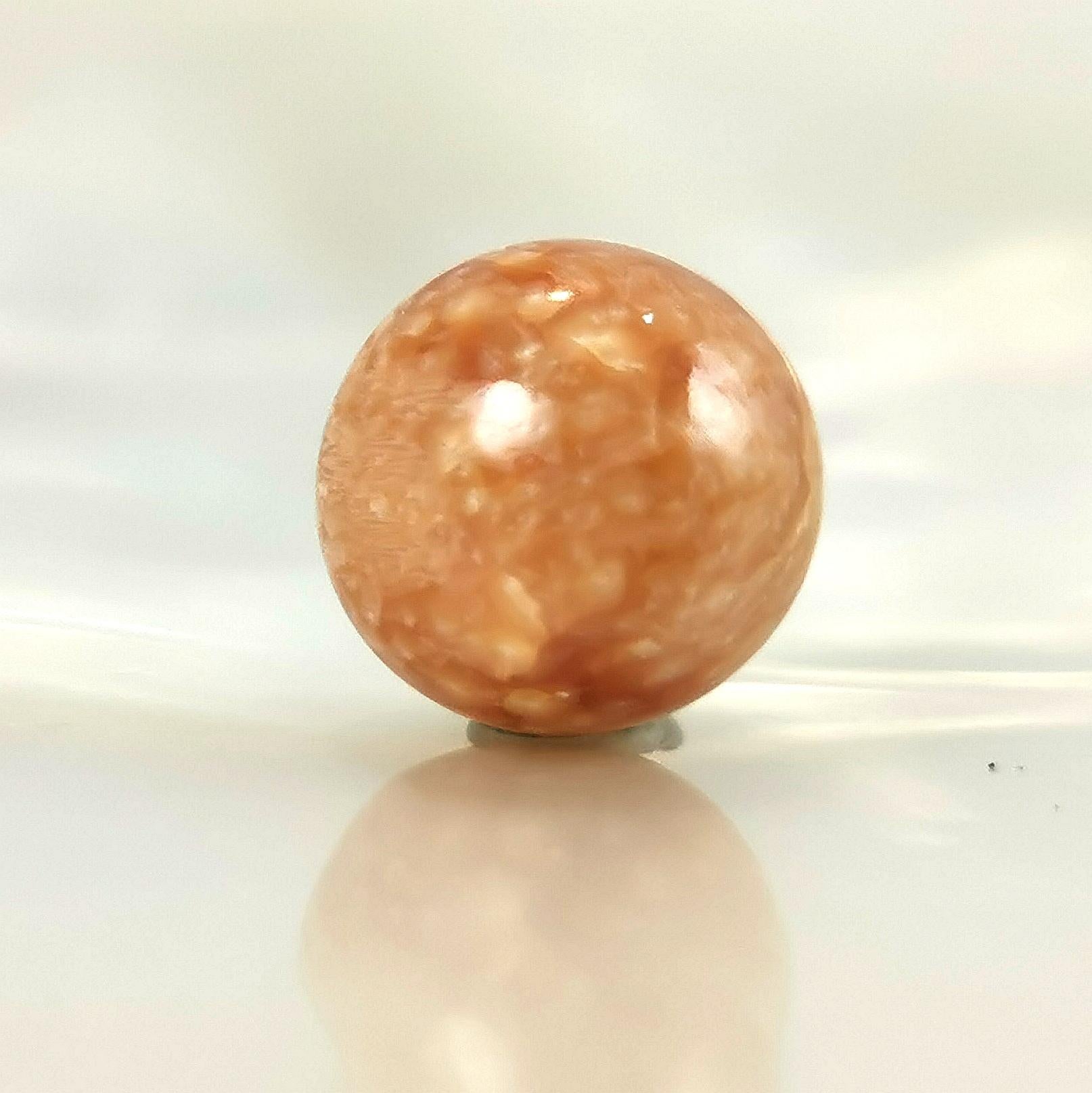 Beautiful and rare round shape natural pearl Melo with fantastic flame patterns (iridescent).
This magnificent pearl was found in a sea snail MeloMelo which habitat area is from South East Asia.
That natural pearl growth 1mm each year and its size