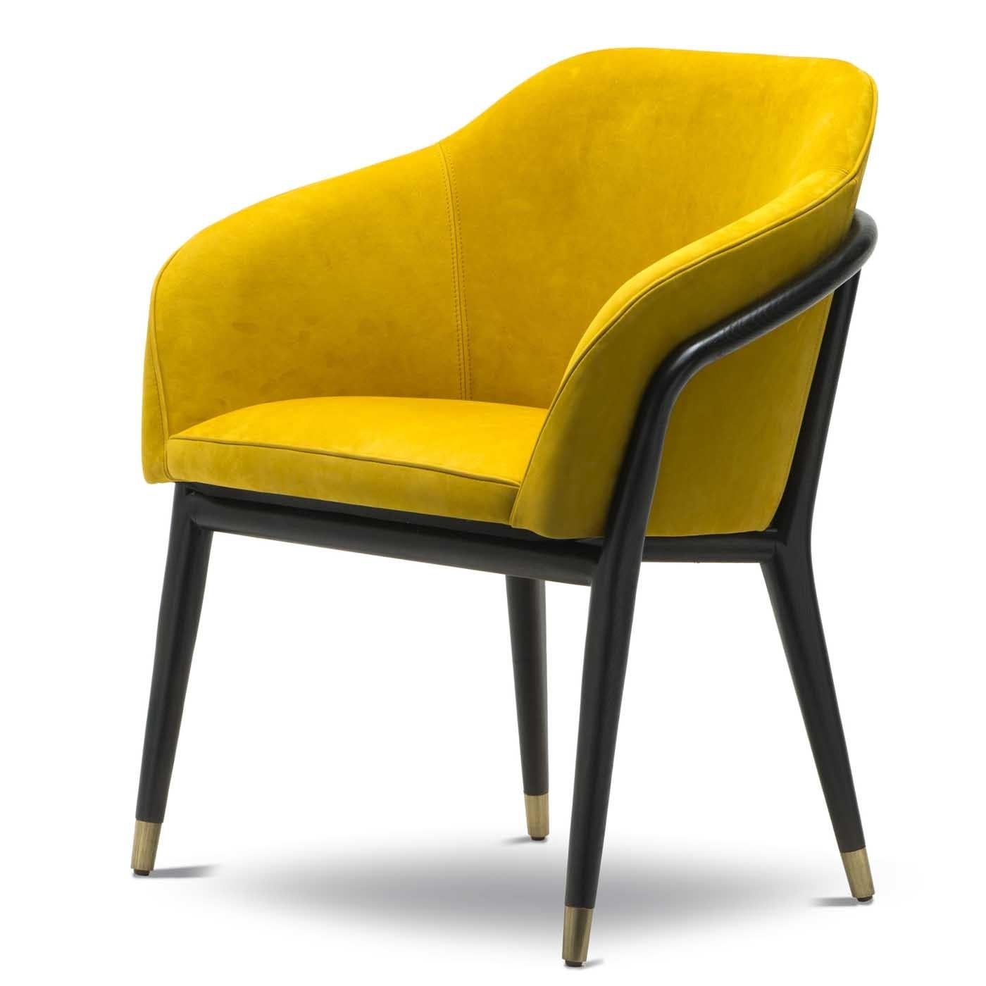 A dash of vibrant color and a midcentury inspiration are the distinctive qualities of this exquisite chair that will enliven a modern entryway, living room, or private study. The base in solid cinder-colored ash has metal tips with a satin brass