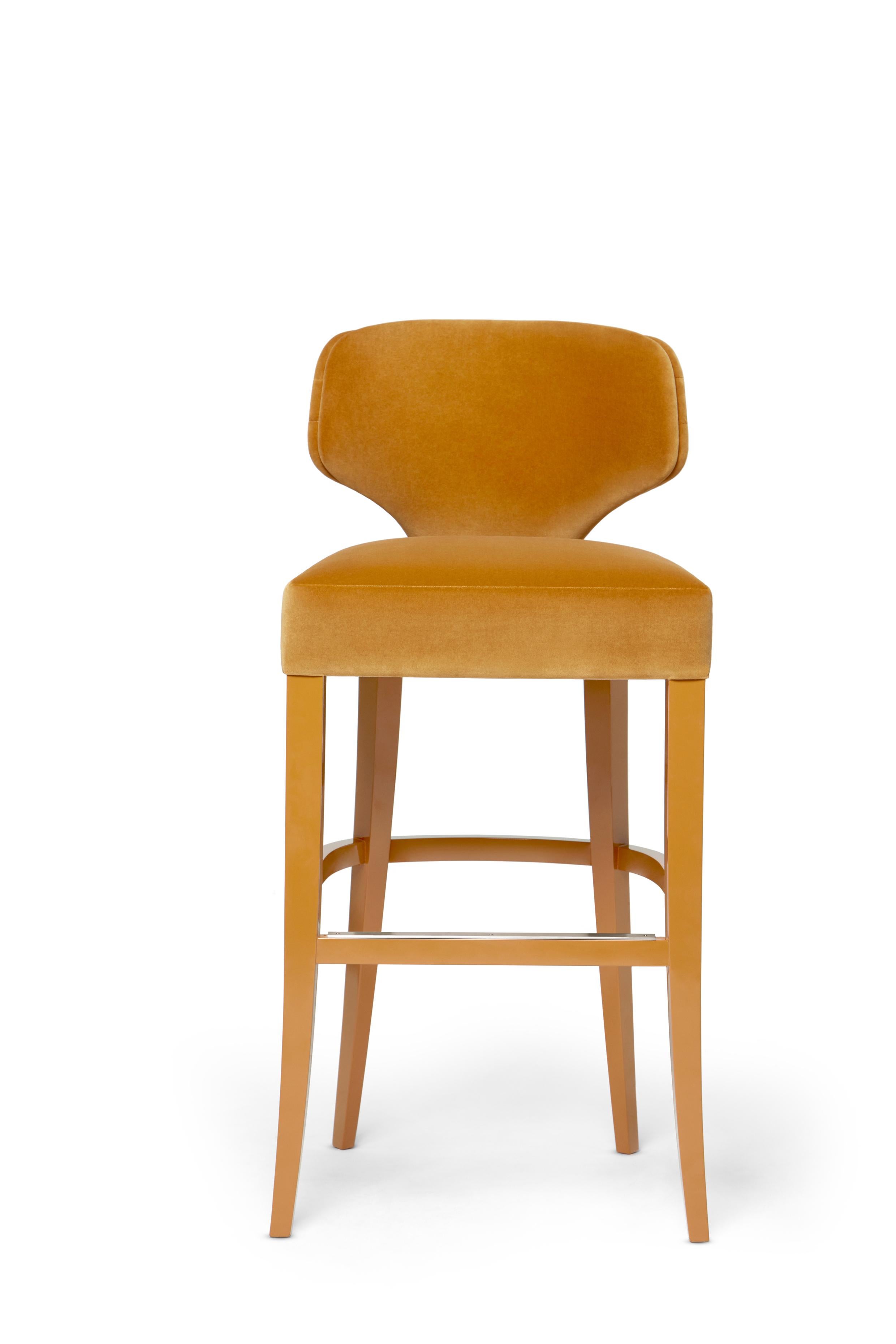 Melody Bar Stool by Munna
Dimensions: D 50 x W 50 x H 105 cm. SH: 80 cm.
Materials: Solid wood, foam, and upholstery.
Finish: Upholstery: Cotton Velvet, ref. Mustard, CV 10. Legs: Mustard Gloss Lacquer.

Available in all Munna fabrics except Wild