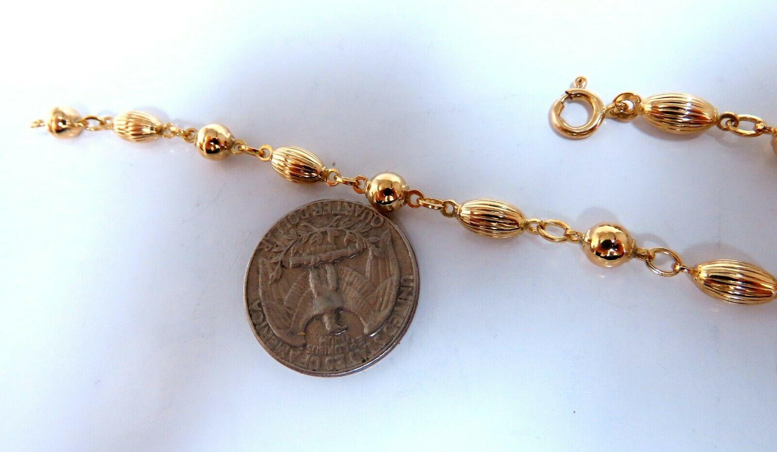 Melon & Ball Bead Chain Link 

Bracelet

Durable, Well Made

14kt. yellow gold

6.3 Grams.

5mm wide

7 inch long

wide caliber clasp.
