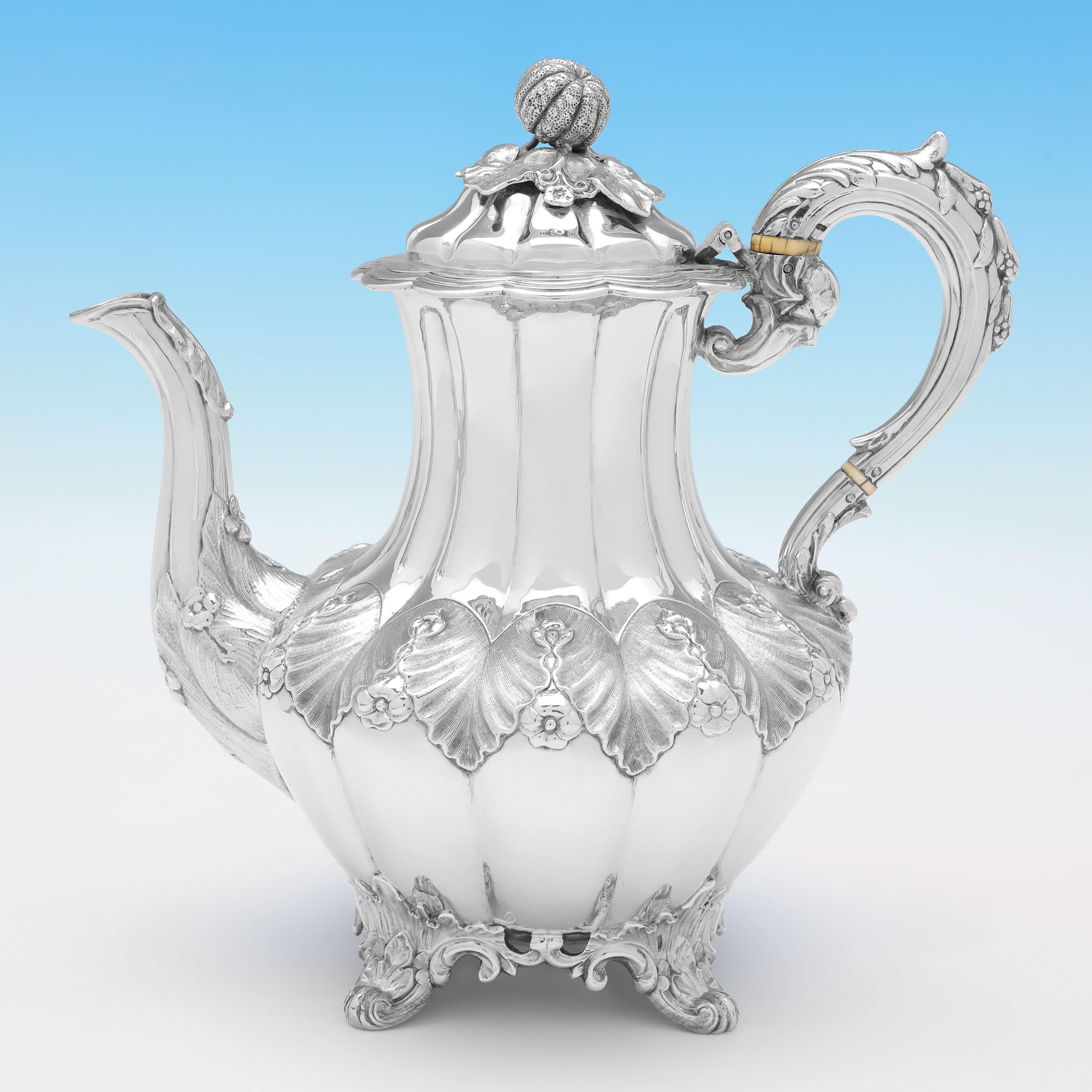 Hallmarked in London in 1851 by Joseph & Albert Savory, this attractive, Antique Sterling Silver Tea Set, comprises a coffee pot, teapot, cream jug and sugar bowl, all in a 'Melon' shape, with chased acanthus & rose detailing, and gilt interiors to