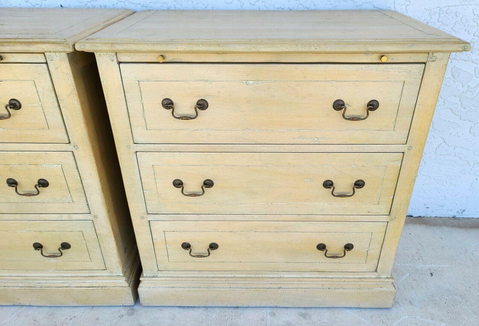Offering One Of Our Recent Palm Beach Estate Fine Furniture Acquisitions of A Pair of Melrose Collection distressed solid wood nightstands by Guy Chaddock
Featuring 3 drawers and pull-out serving extensions.

Coloration:
The finish is original and