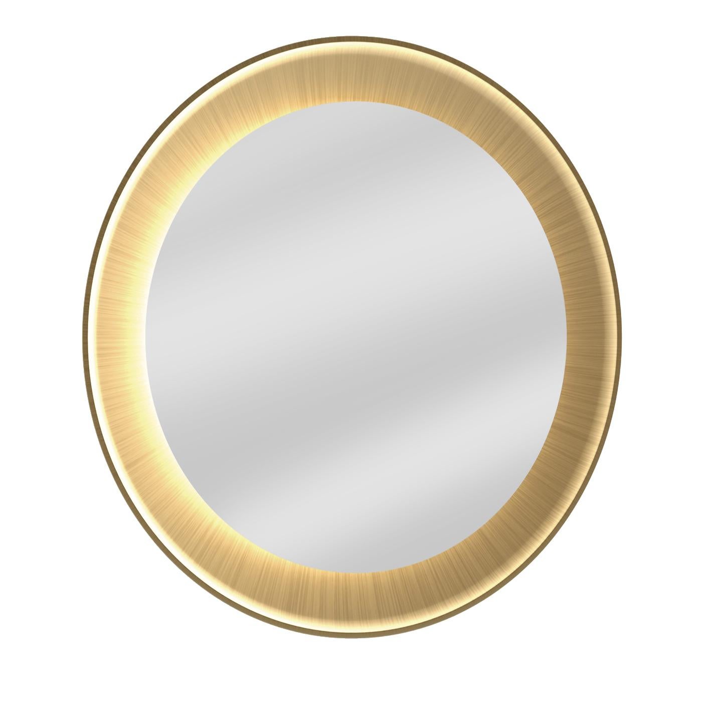 Distinctive for its linear silhouette and precious brass finish, this refined piece boasts an MDF frame enclosing the beveled round mirror, which is enriched by a circular strip of bright LED lights. This wall mirror can be painted in several colors