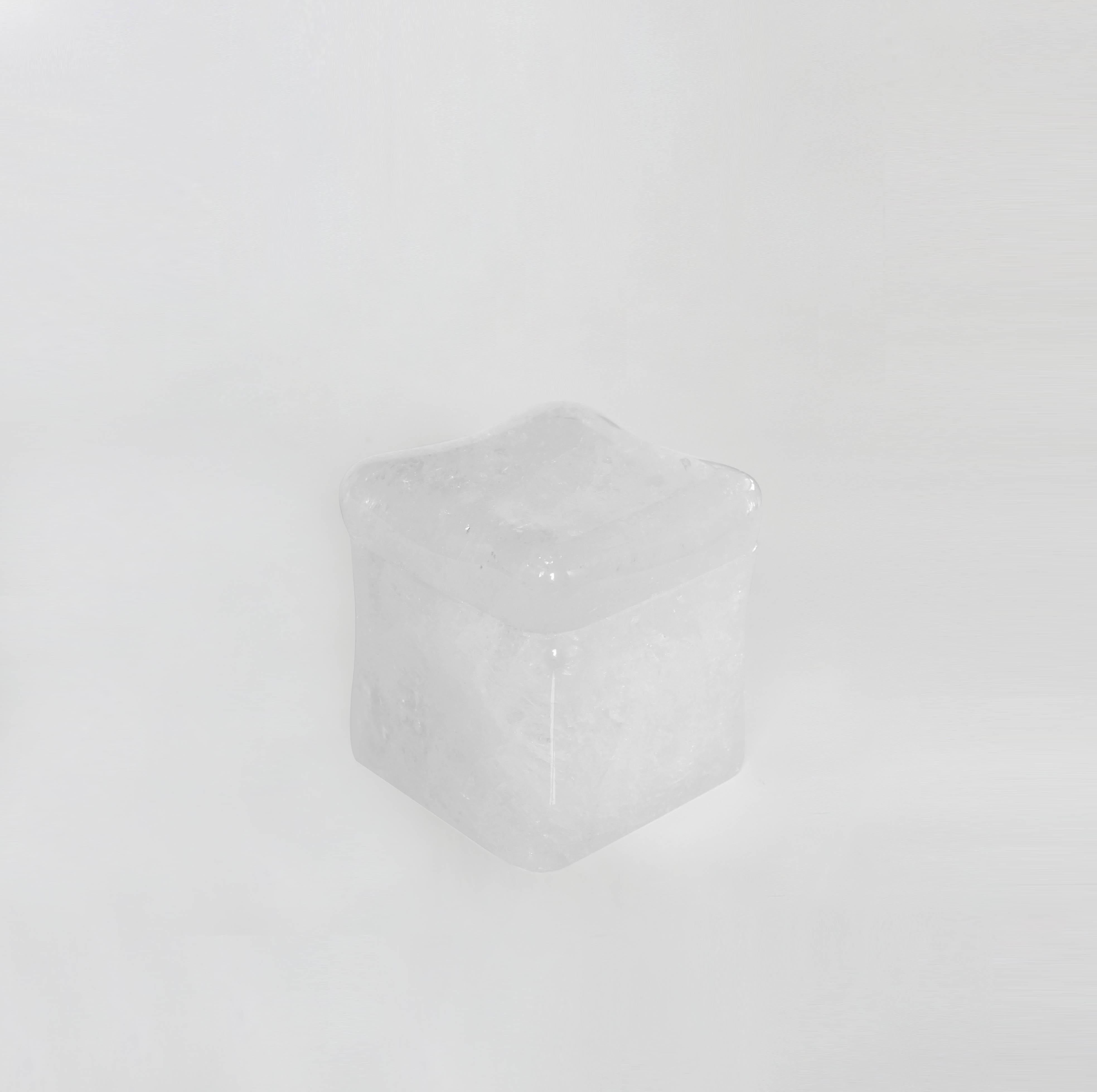 Finely carved rock crystal box with cover. Inspired by melting ice. Created by Phoenix Gallery, NYC.