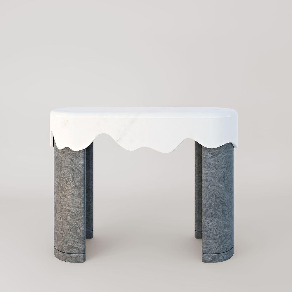 Melt console - grey vavona by Marble Balloon.
Dimensions: W120 x D40 x H90 cm
Materials: Grey vavona, light travertine, white sugar.

Also available: California burl, walnut burl, 

Melt tables and consoles are registered design products of