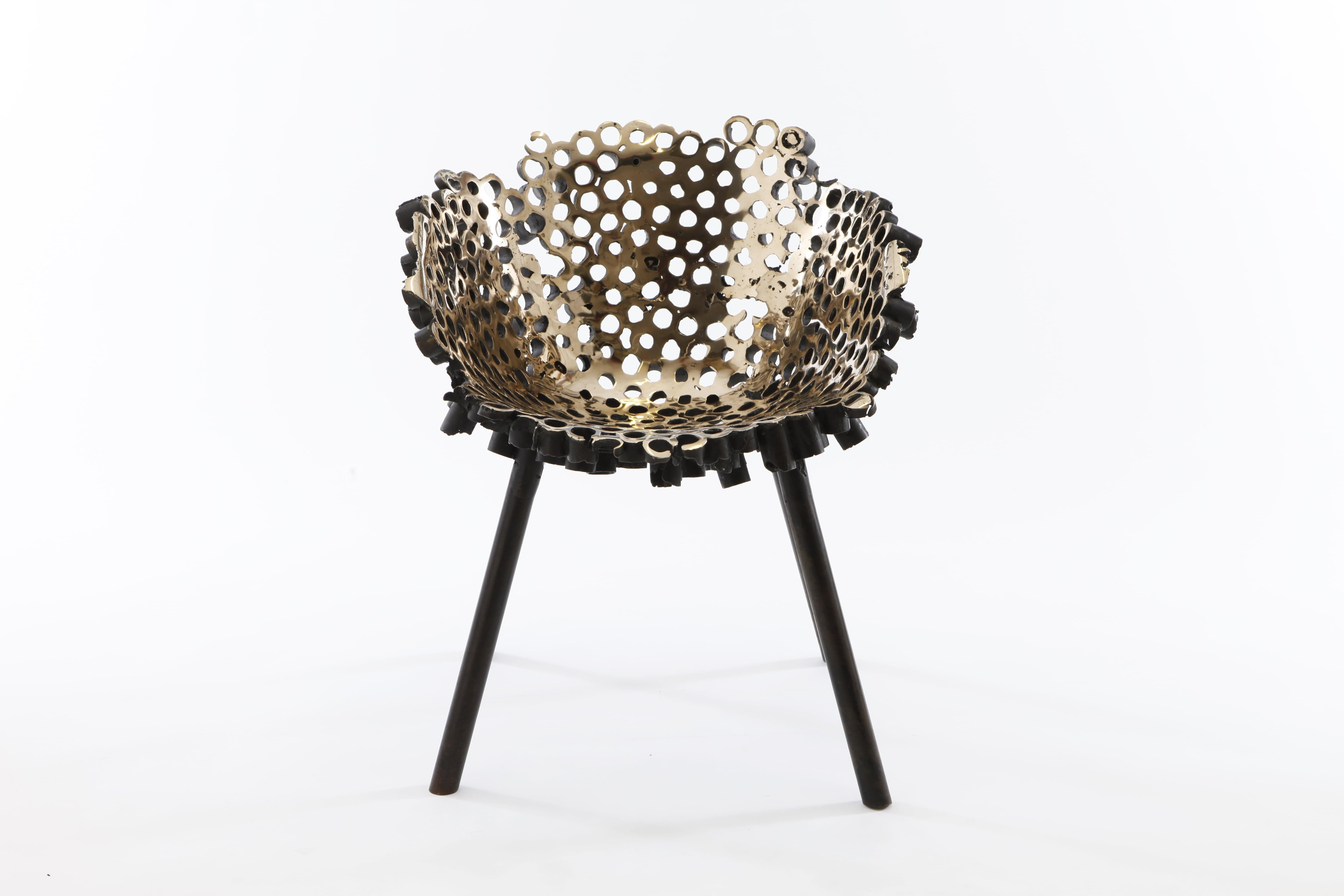 Meltdown Chair, Bronze #2 is a piece by English artist Tom Price, from the Meltdown Series. This chair is created using a ‘lost-plastic’ casting technique: a chair made from polypropylene tubes is encased in a thick ceramic shell and then melted