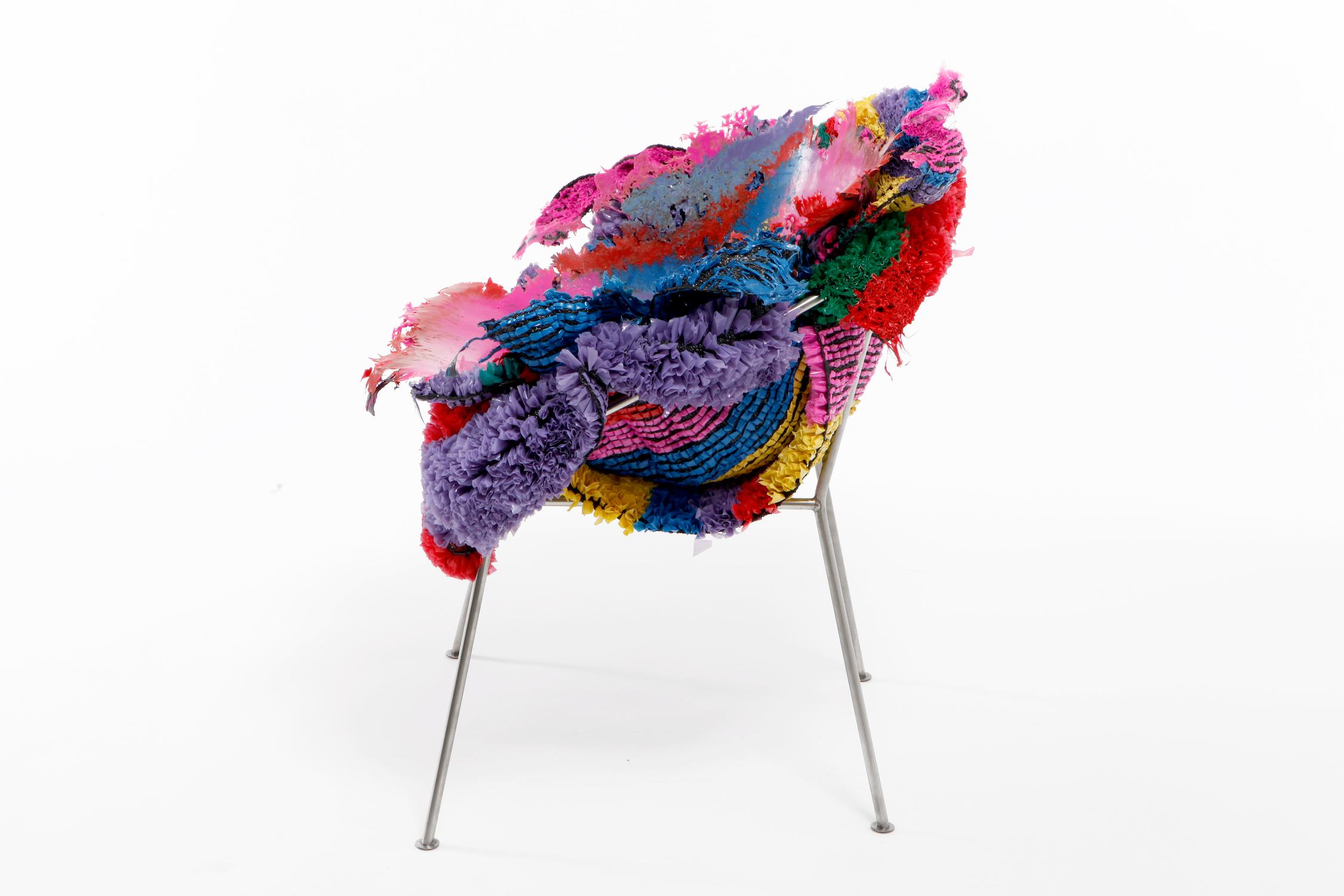 'Meltdown Chair, PE Stripe' is a piece by English artist Tom Price, from the Meltdown Series. This chair is made from plastic rugs and a stainless-steel frame. The artist assembles a stack of colourful woven plastic rugs and then he presses it on a