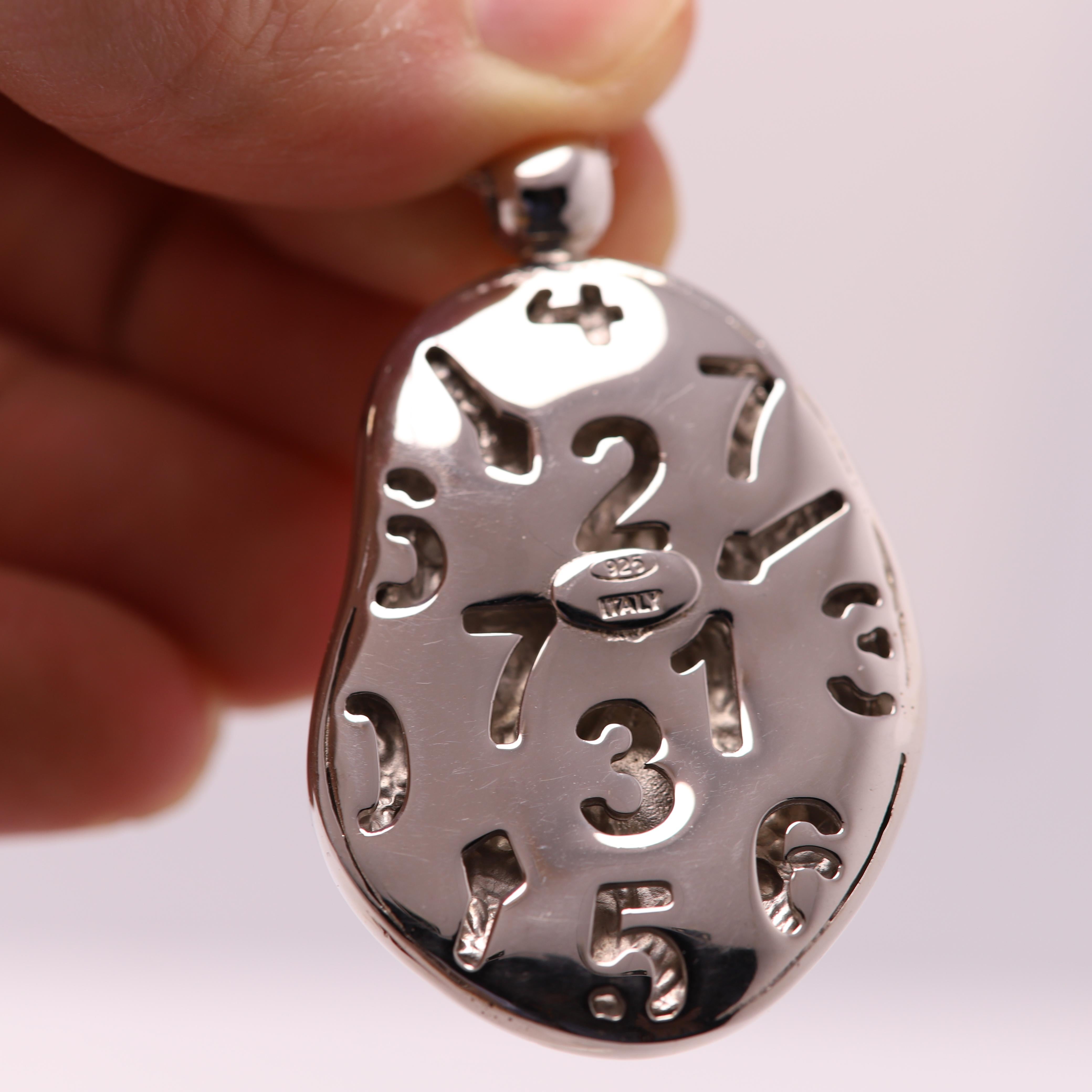 This is a set - Pendant and Ring
Hand Made in Italy, 
This is a unique set of a pendant and ring brilliant red color Enamel and Sterling Silver 925
Art replica inspired by the famous Dali melting clock.
Ring area approx size 27 x 20 mm (1' inch) 14
