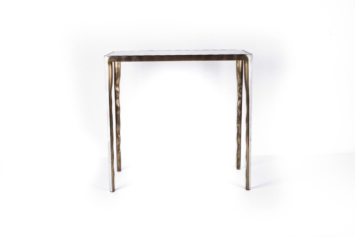 The Melting Nesting Side Table in Large is part of a series of nesting side tables (sold separately) . One can purchase the tables on their own or buy them as a set to create elegant & geometric shapes. This piece is inlaid in mother of pearl and