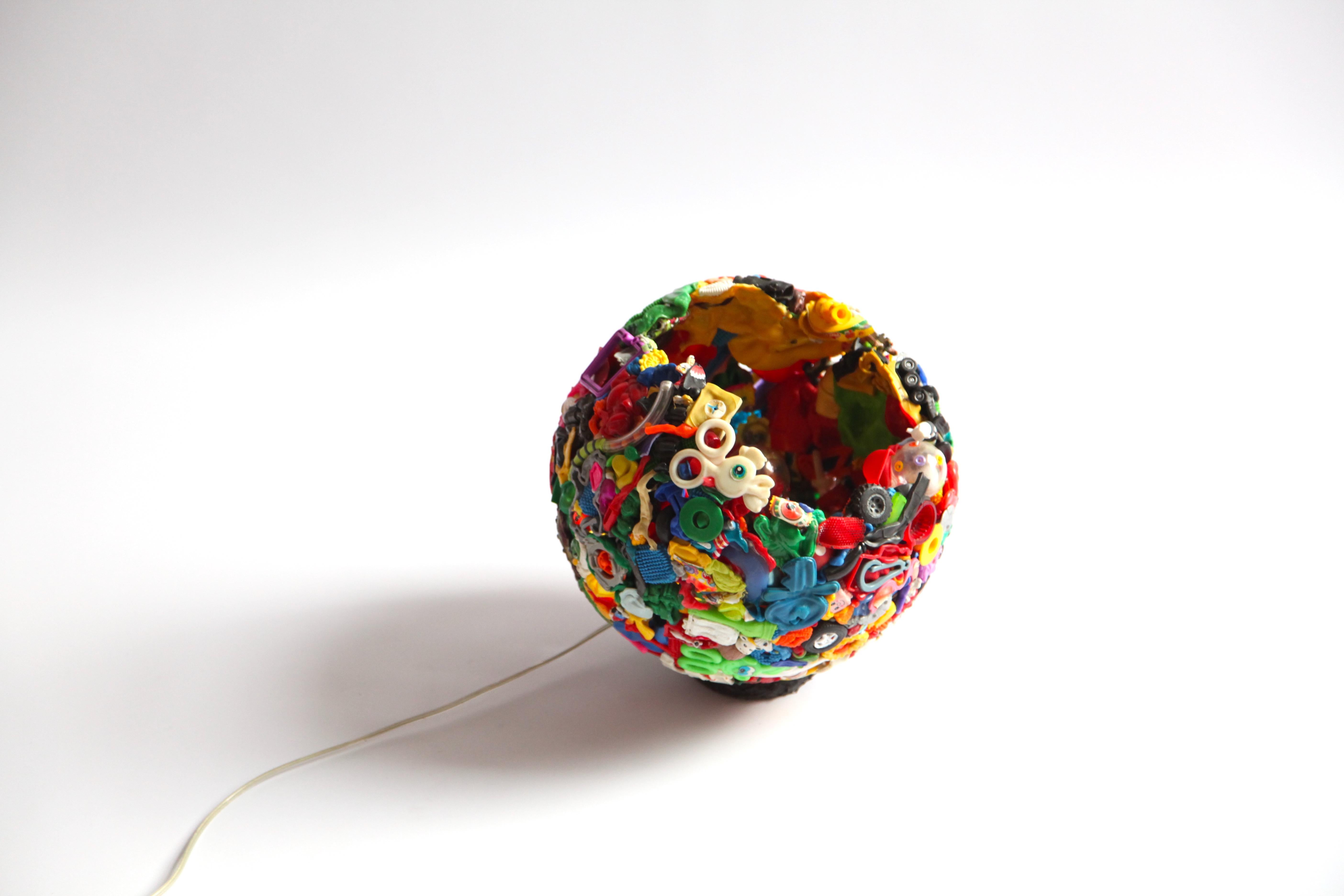 A one of a kind unique lamp, made in 1999. Richard Hutten used ready mades and plastic toy wased to create a new object. 

Already then he was engaged to sustainability and circularity.

The Meltingpot was only showcased at a few places and