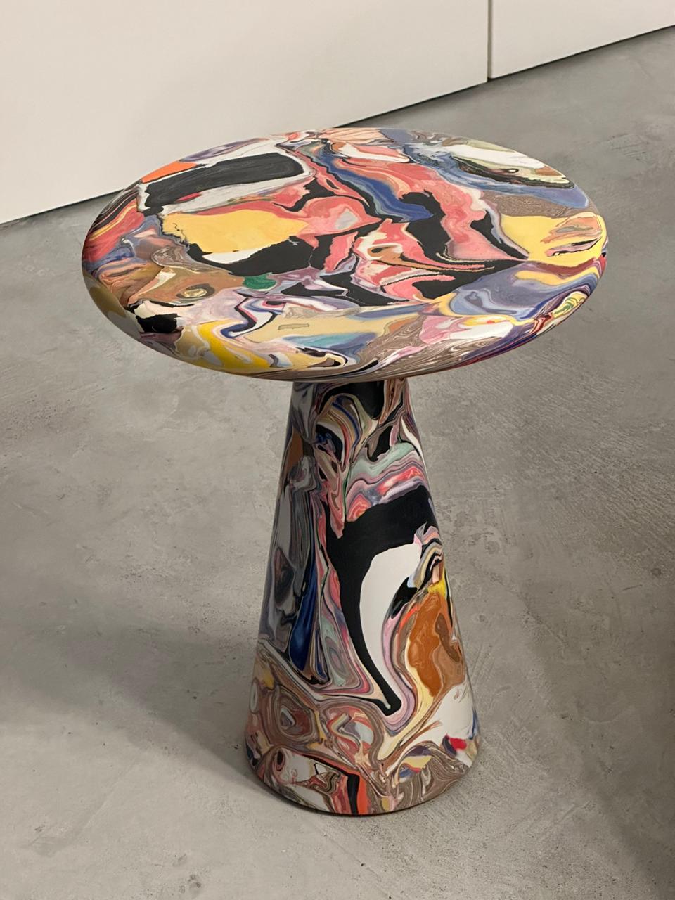 The Meltingpot table designed by Kooij plays a keystone role in the circular design practice at Kooij. Discarded recycled plastic prototypes, production faults, and color tests form the basis of the conglomerate Meltingpot.