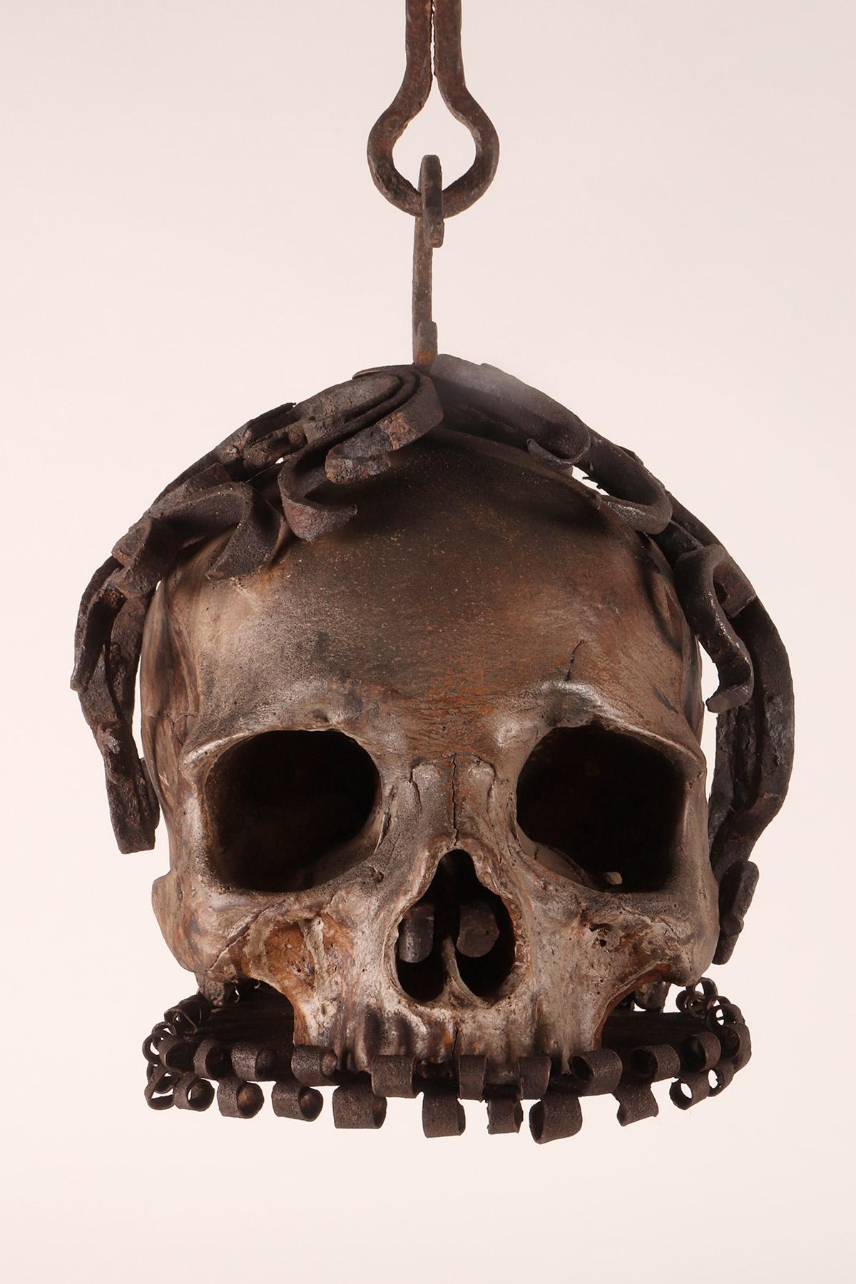 Memento mori. A caged and suspended skull sculpture, Germany, late 17th century. In Good Condition In Milan, IT