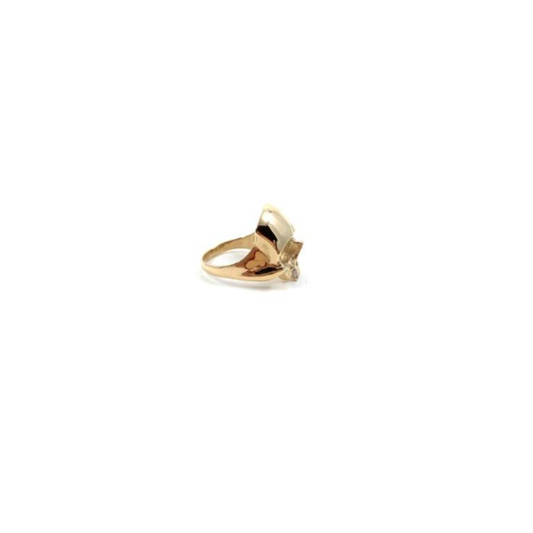 This skull will sit proudly on any of your fingers! Designed and fabricated by Alex Jacques Designs, each hand sculpted ring is cast in solid 14k yellow gold with a cast-in-place natural baguette cut diamond (tooth) and finished by hand. The diamond