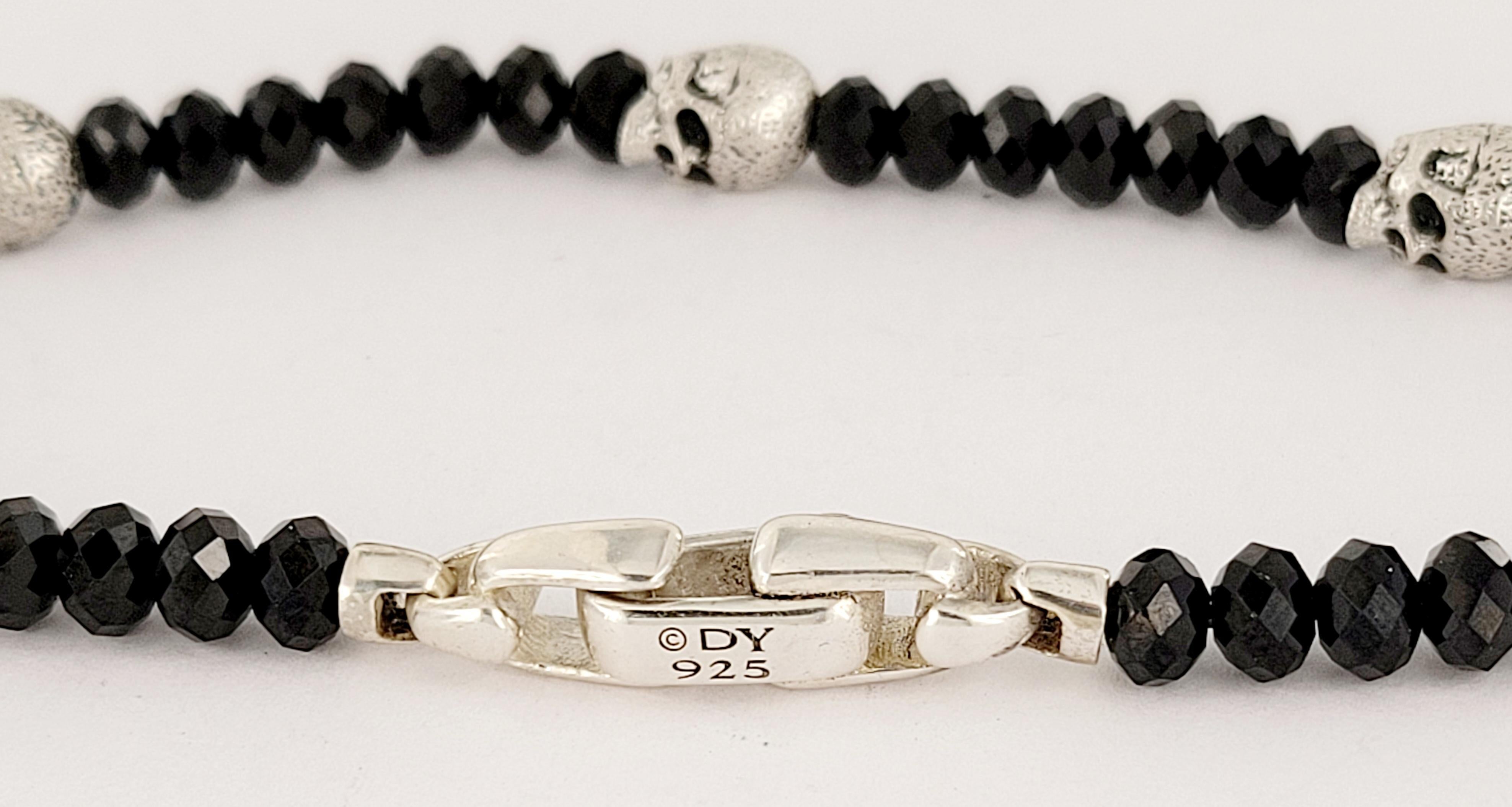 David Yurman 
Black Spinel & Three Skulls 
Material Sterling Silver 
Metal Purity95
Bracelet Length 8.5mm from end to end
Bracelet Width 5mm
Weight 15.6gr 
Condition New, never worn
Comes with David Yurman Pouch